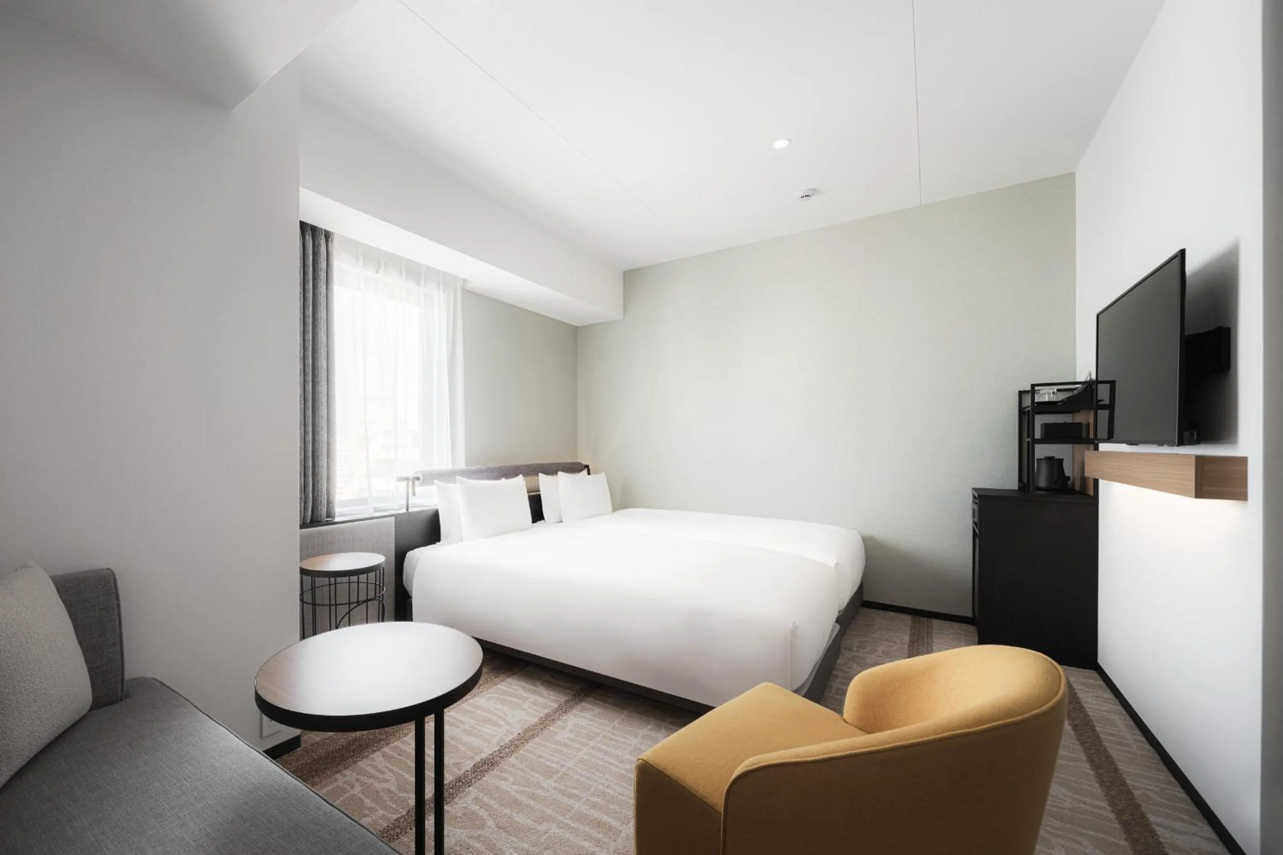 Photo of the whole room, Bed in Nest Hotel Naha Nishi