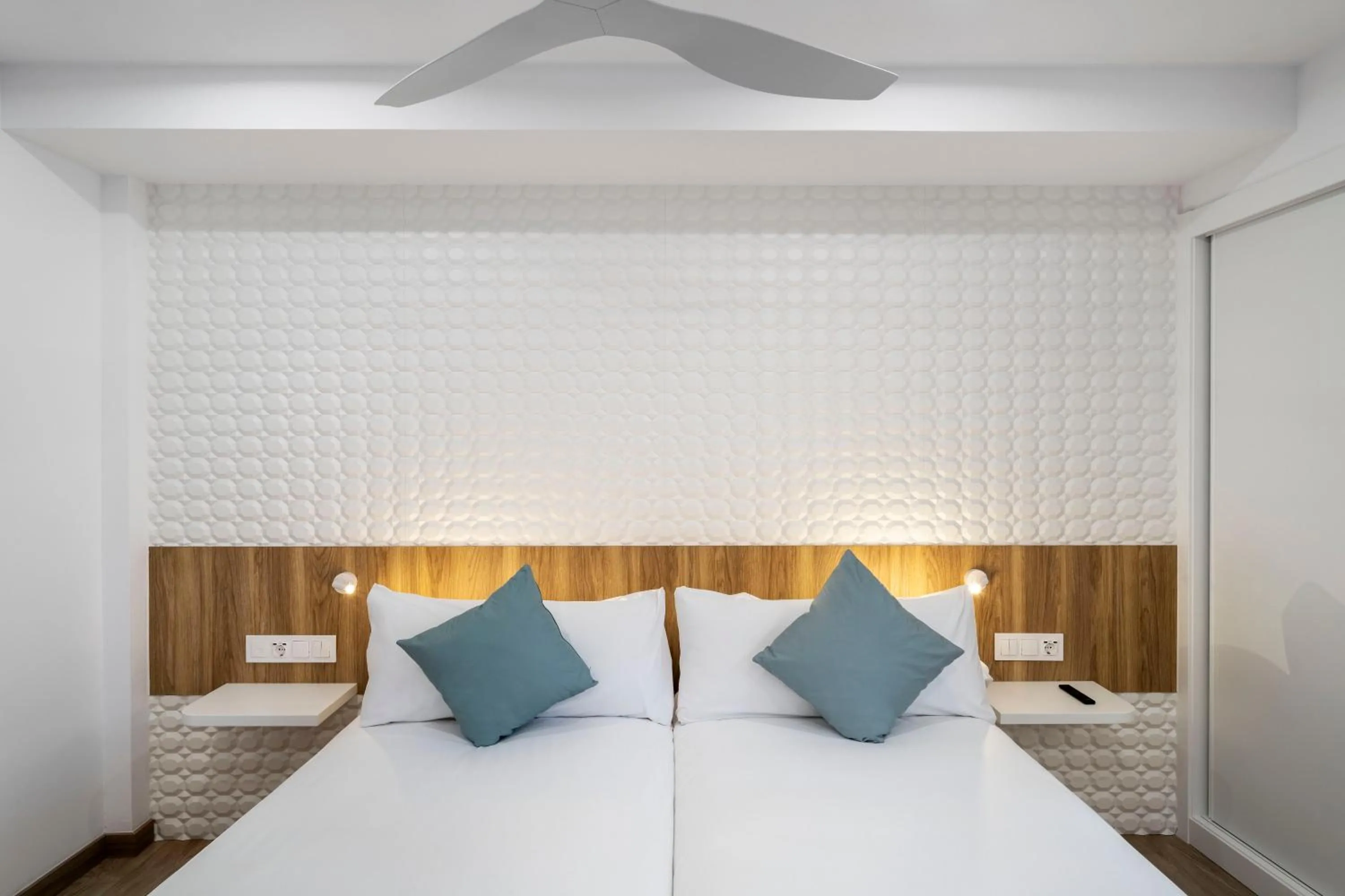 Bed in Odyssey Rooms Alicante