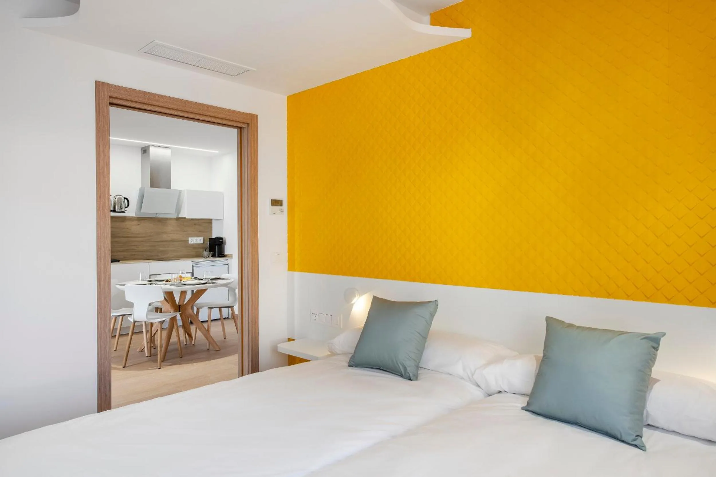 Bed in Odyssey Rooms Alicante