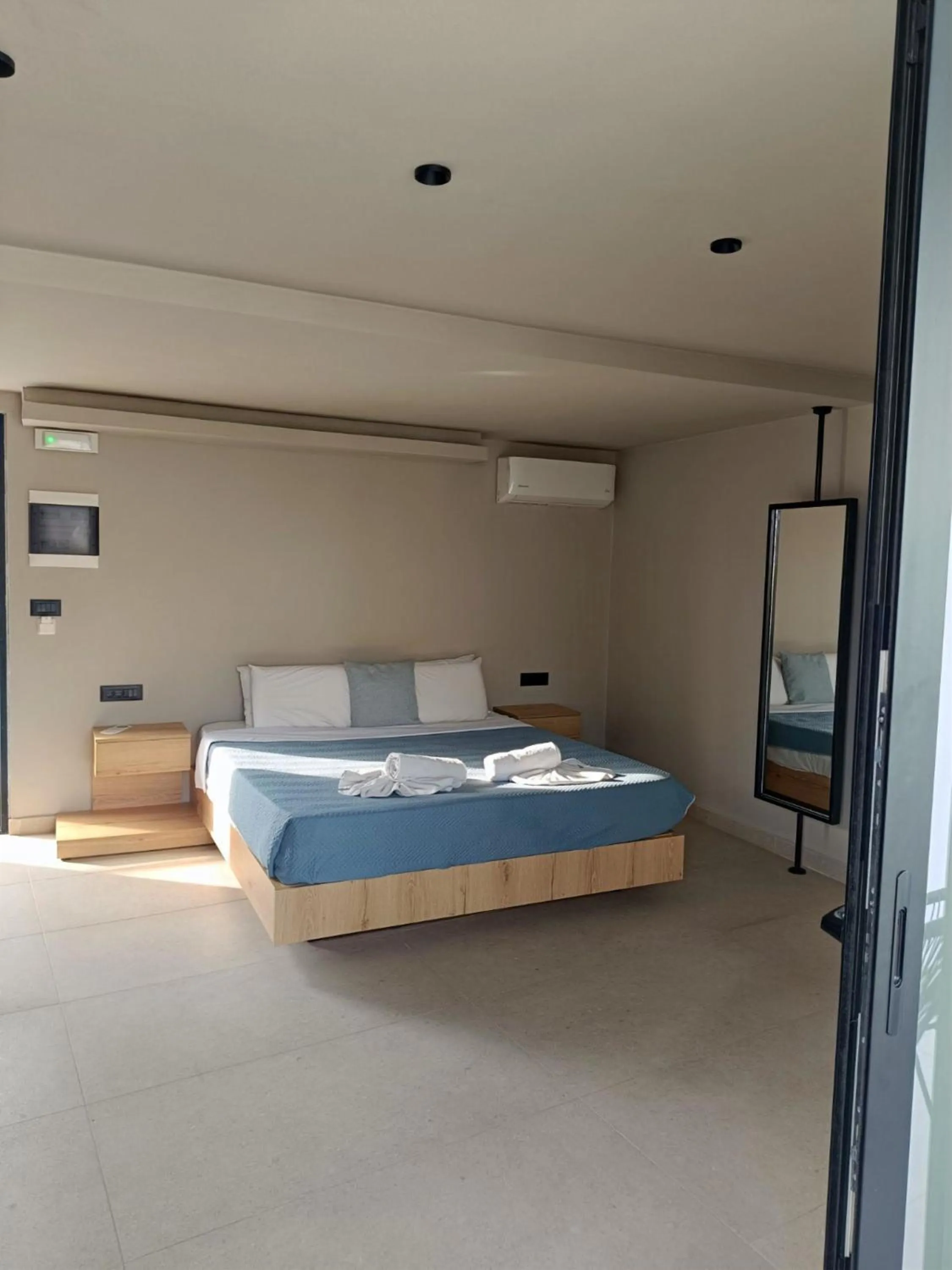 Bed in Kouros Home & Suites