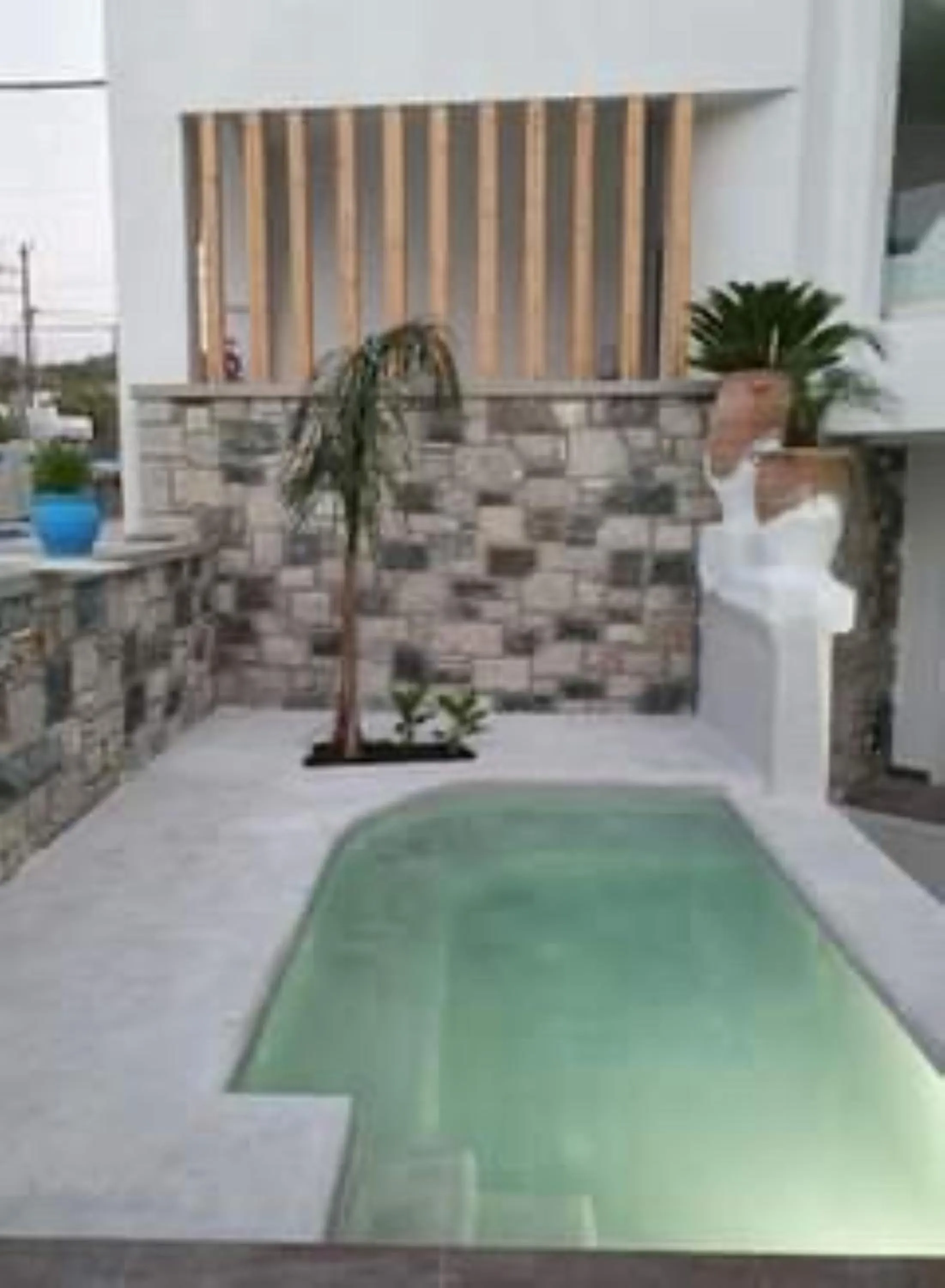 Swimming pool in Kouros Home & Suites