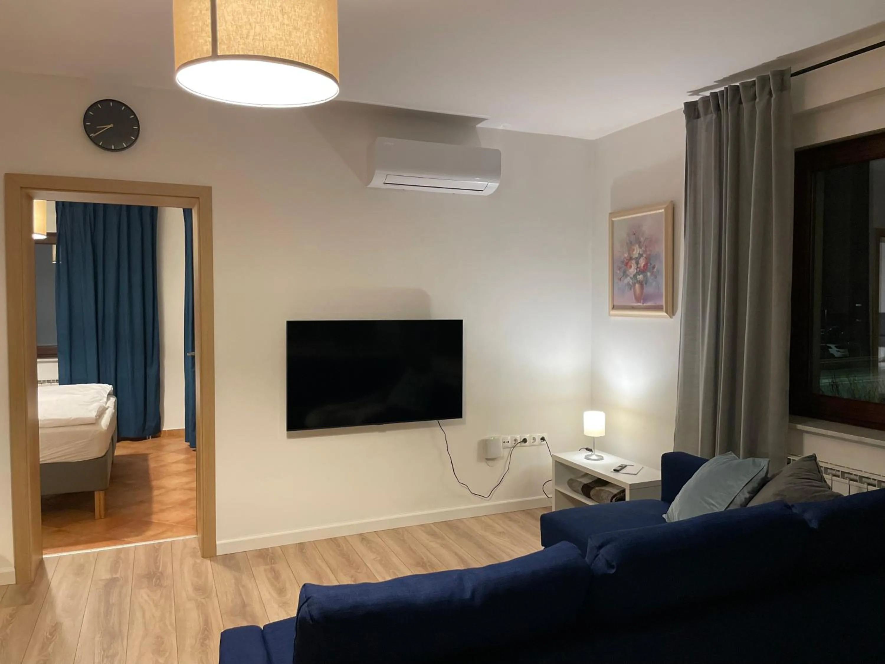 TV and multimedia, Bed in All Seasons Apartments Laško