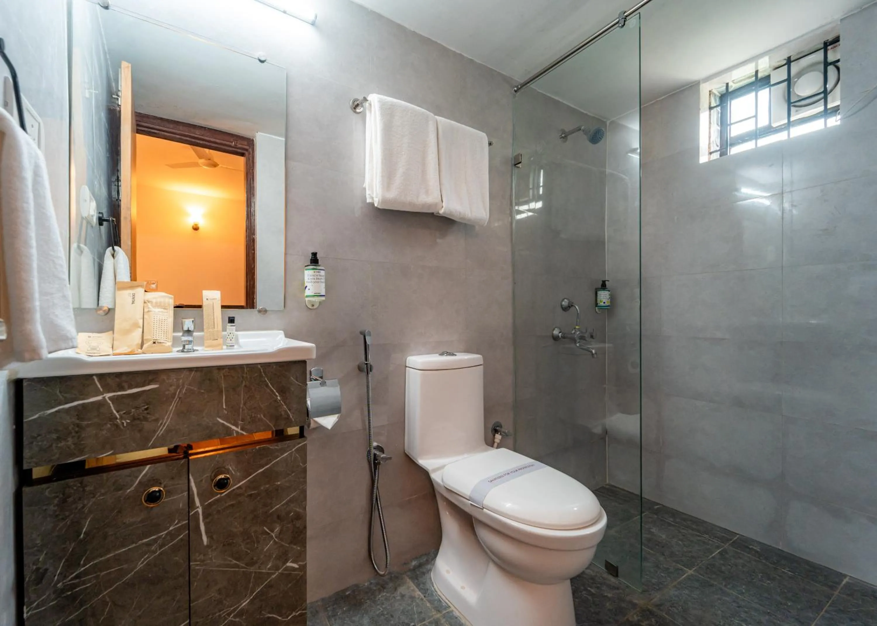 Bathroom in Treebo Clarissa Resort with Swimming Pool