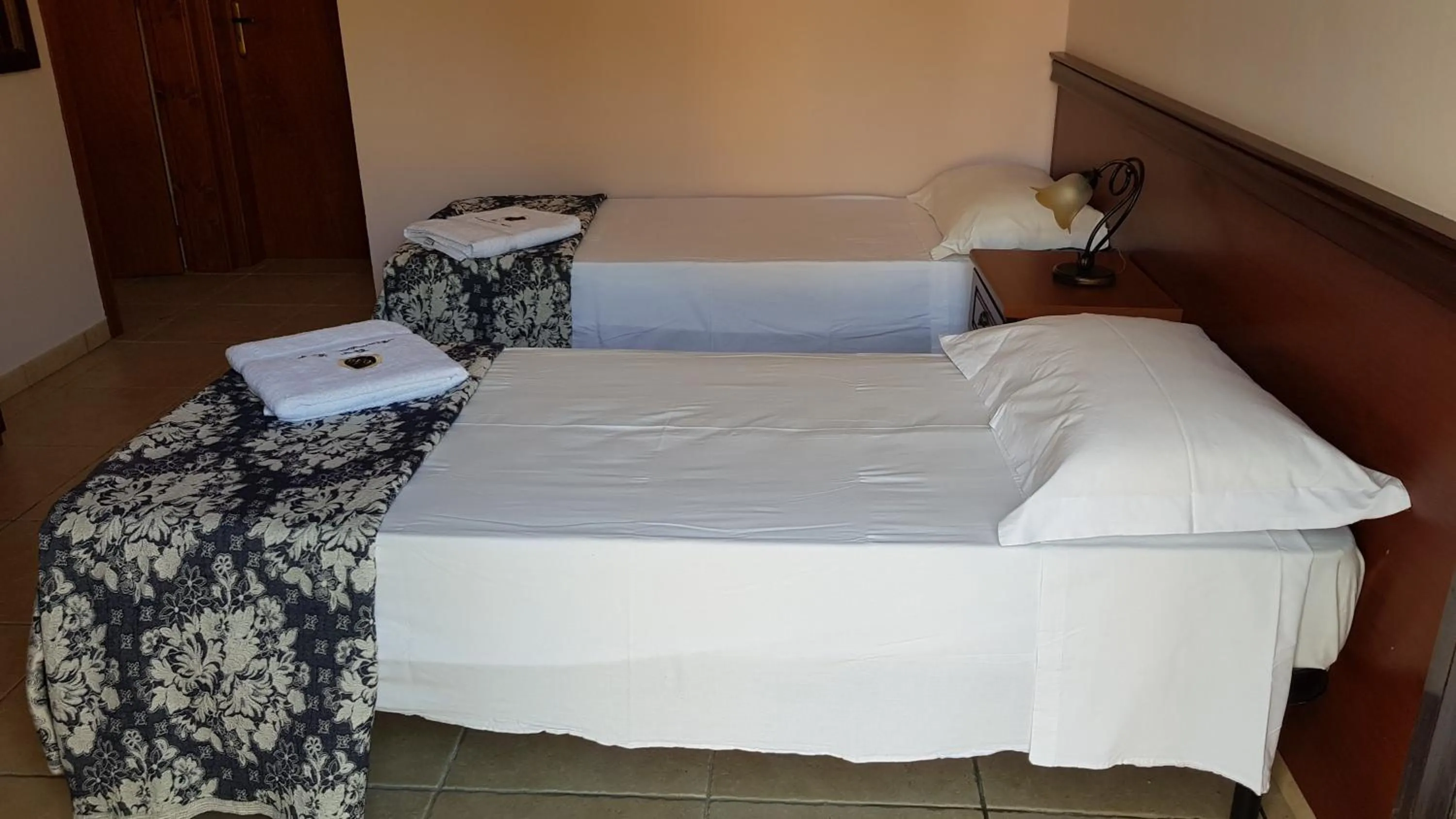 Bed in RELAIS MASSERIA CASINA DEI CARI