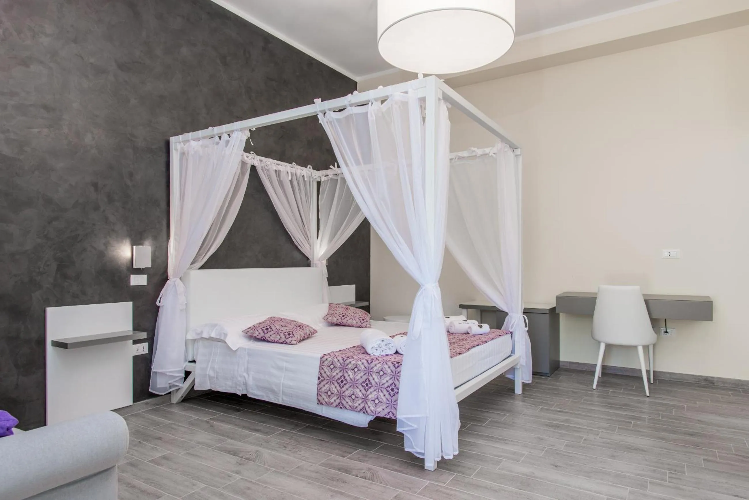 Bed in RELAIS MASSERIA CASINA DEI CARI