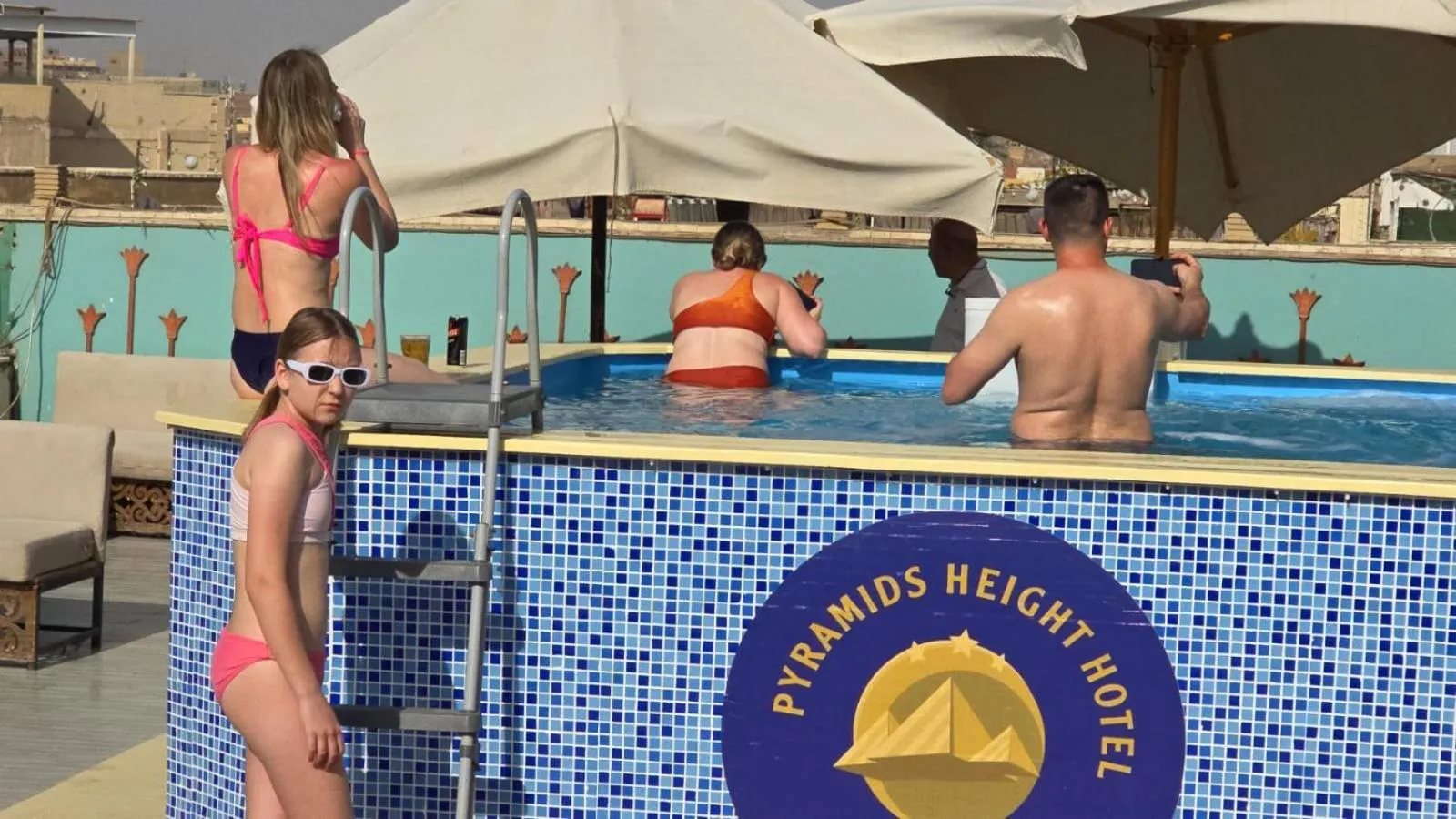People in Pyramids Height Hotel & Pyramids Master Scene Rooftop