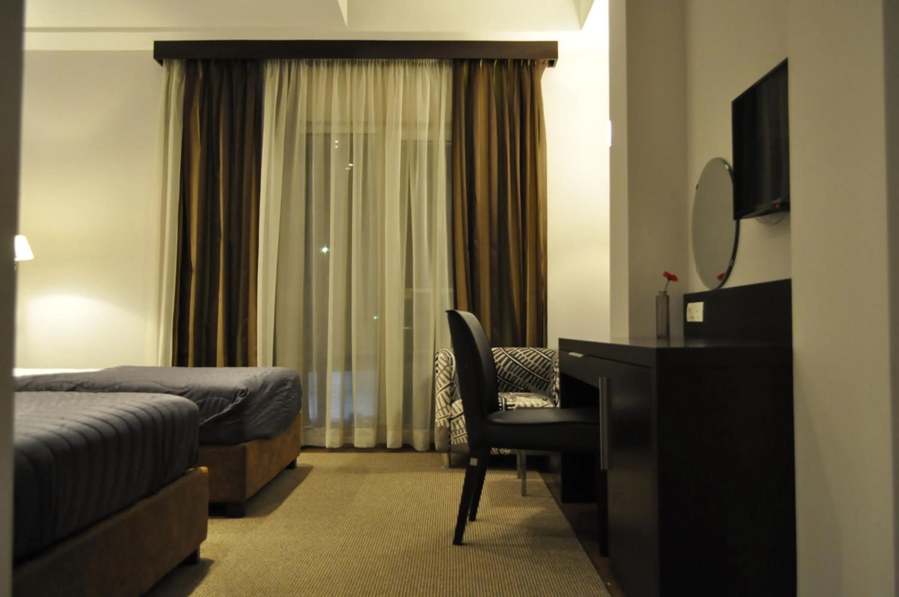 Seating area, Bed in Hotel Dolce International