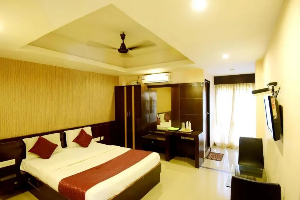 Photo of the whole room, Bed in Shastri Paradise opst to KSRTC Bus Stand