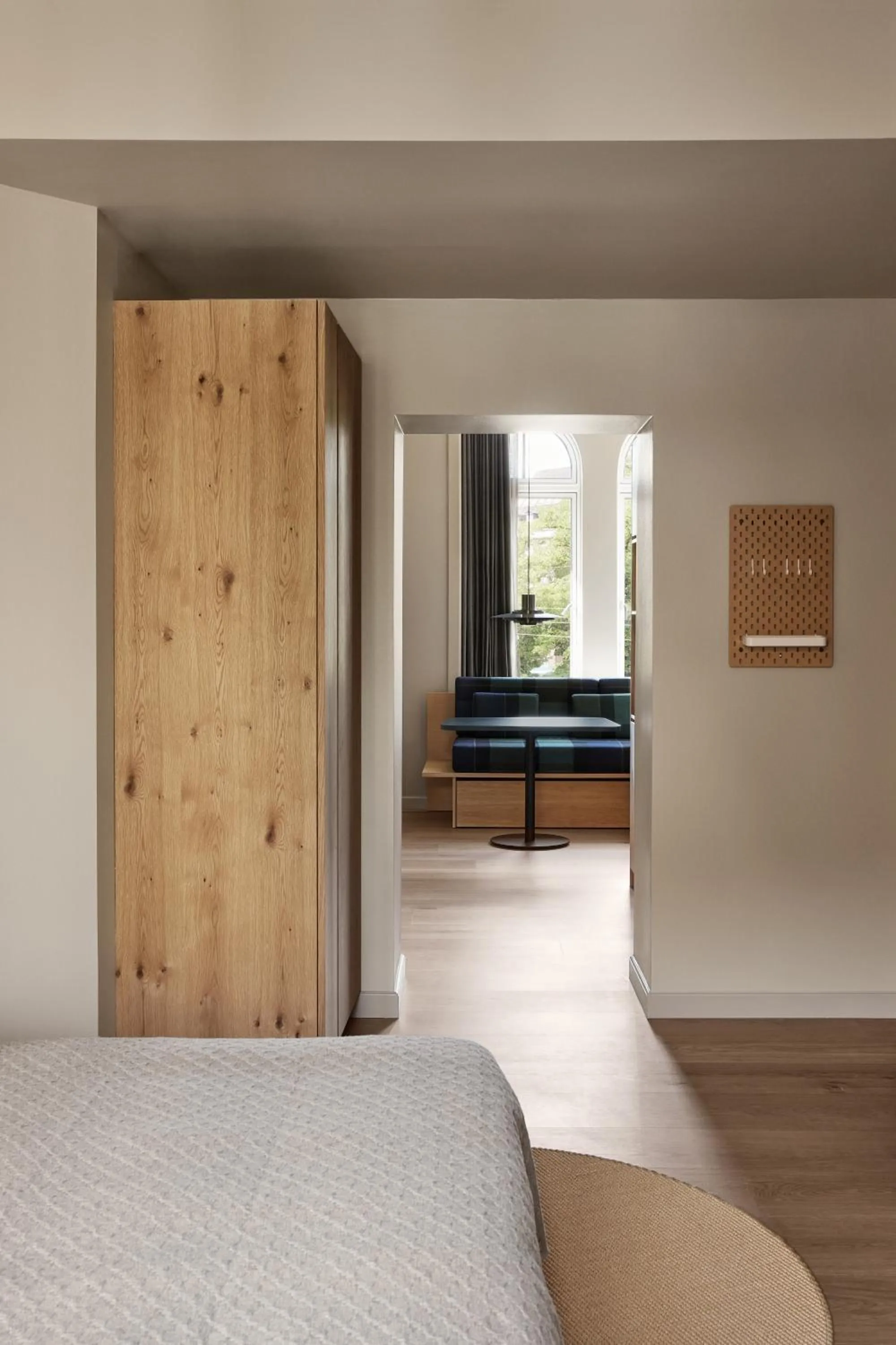Living room, Bed in Apartments by Brøchner Hotels