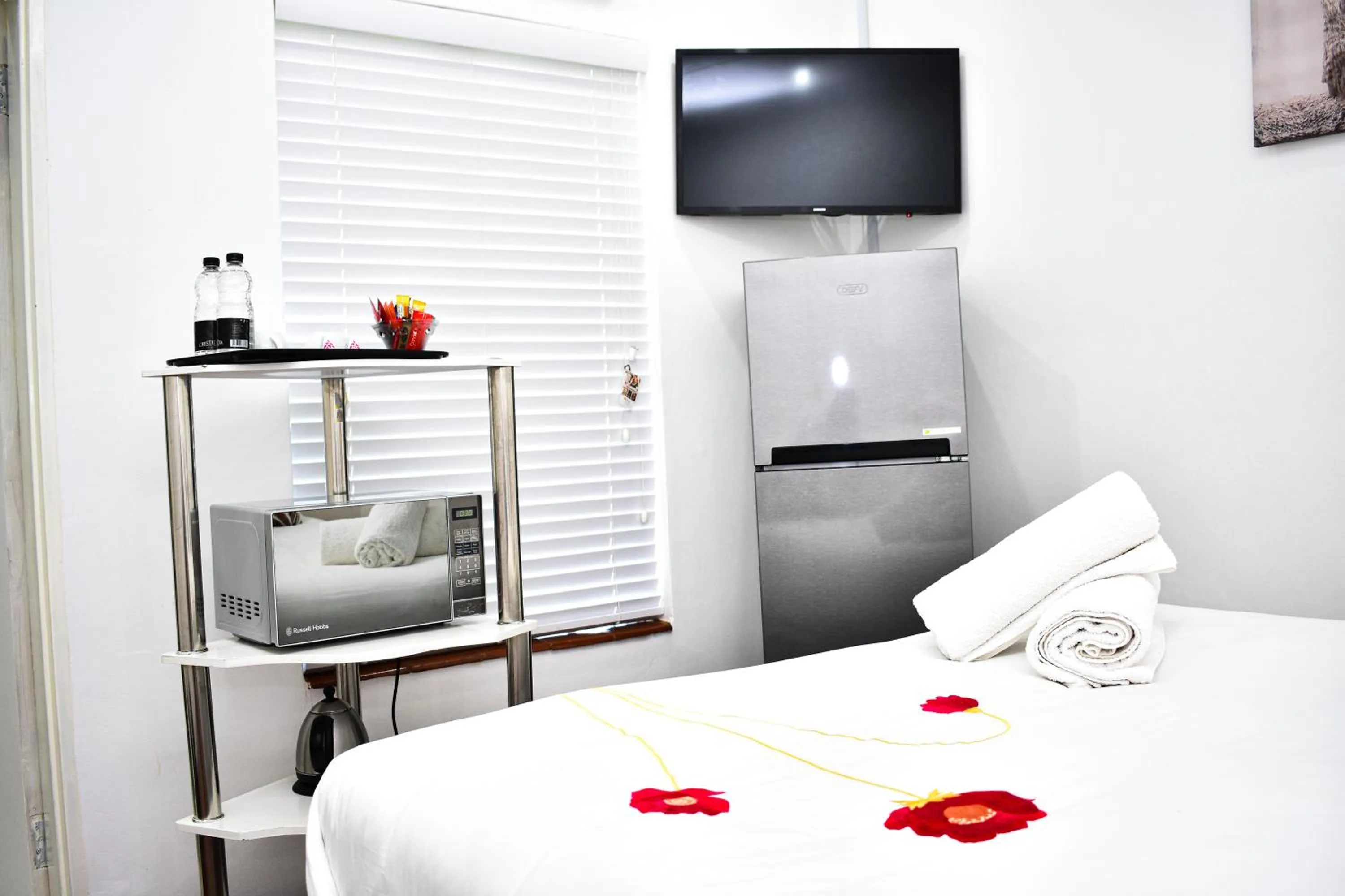 Bed in Heroes Garden Lodge