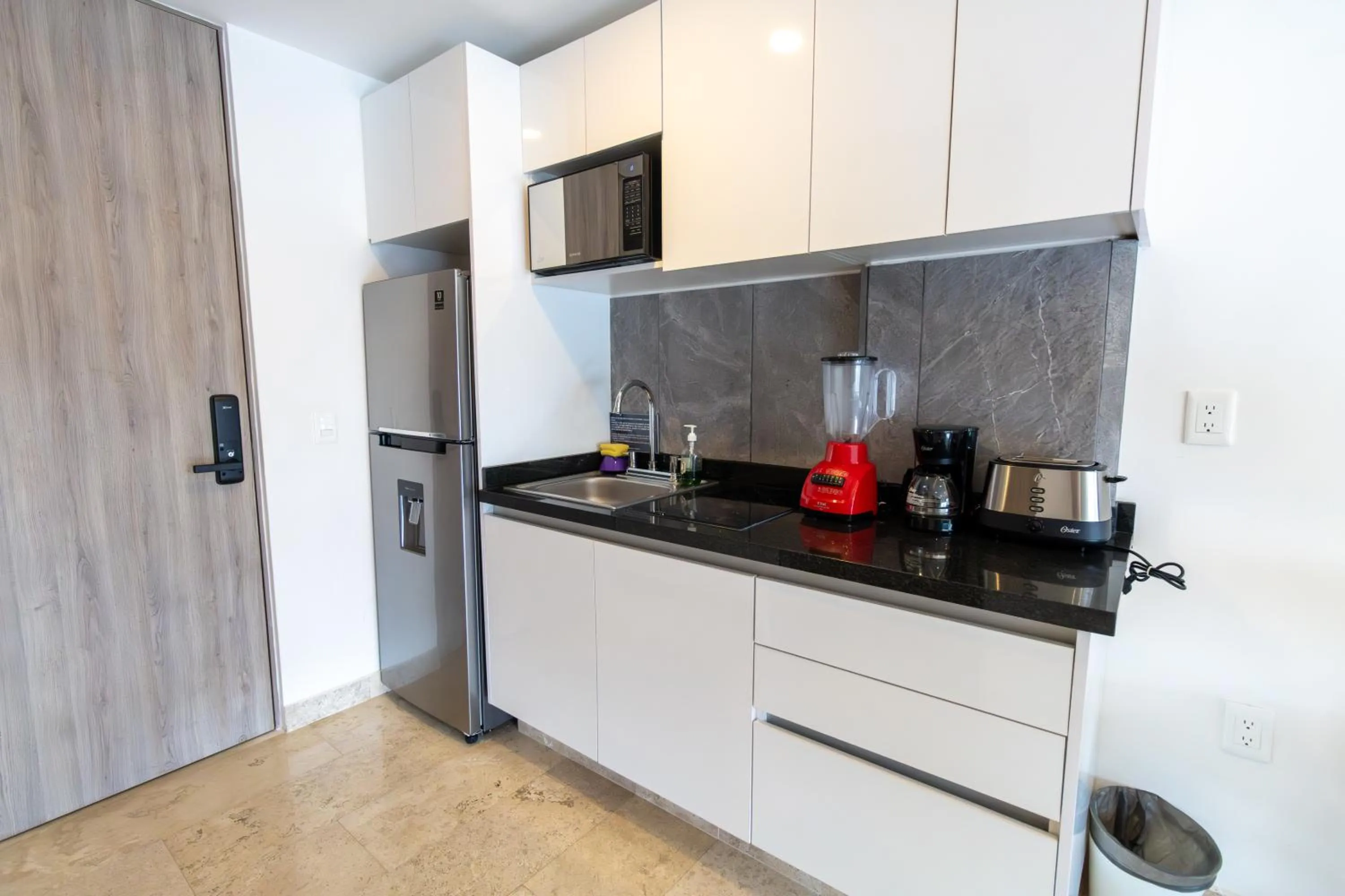 kitchen in Torre Diez by Grupo Amber