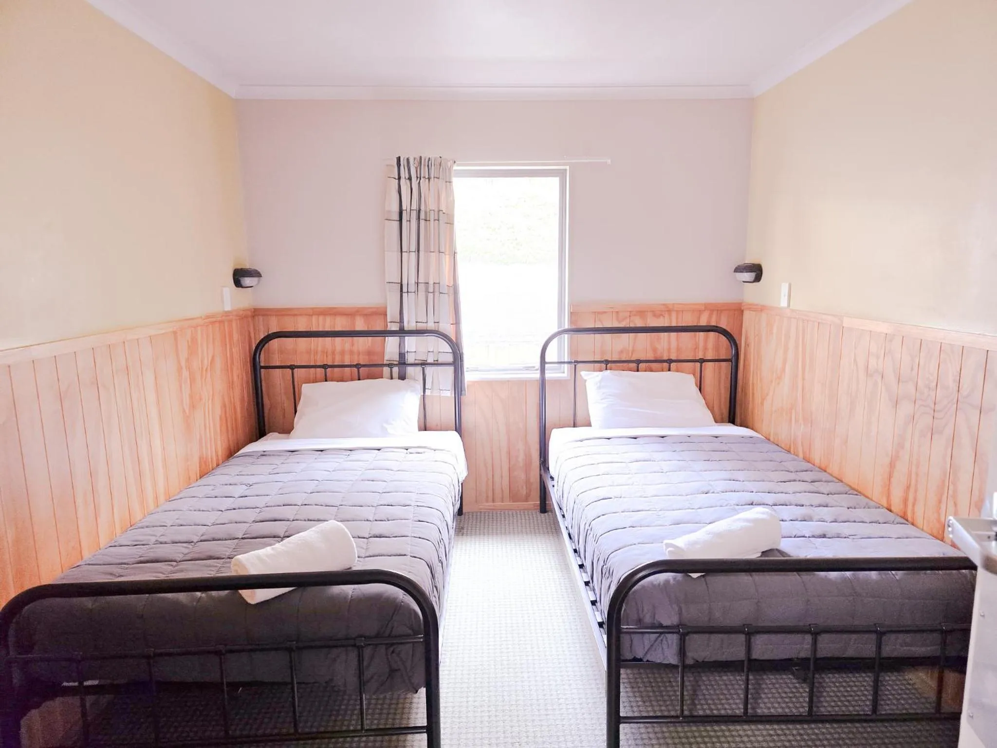 Bed in Waitomo Village Chalets home of Kiwipaka