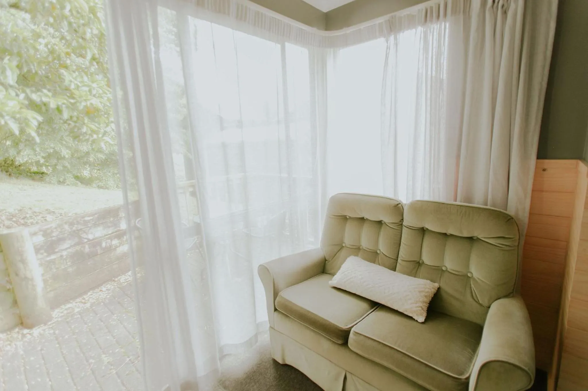 Seating area in Waitomo Village Chalets home of Kiwipaka