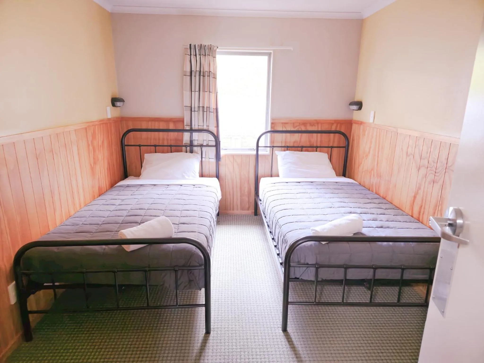 Bed in Waitomo Village Chalets home of Kiwipaka