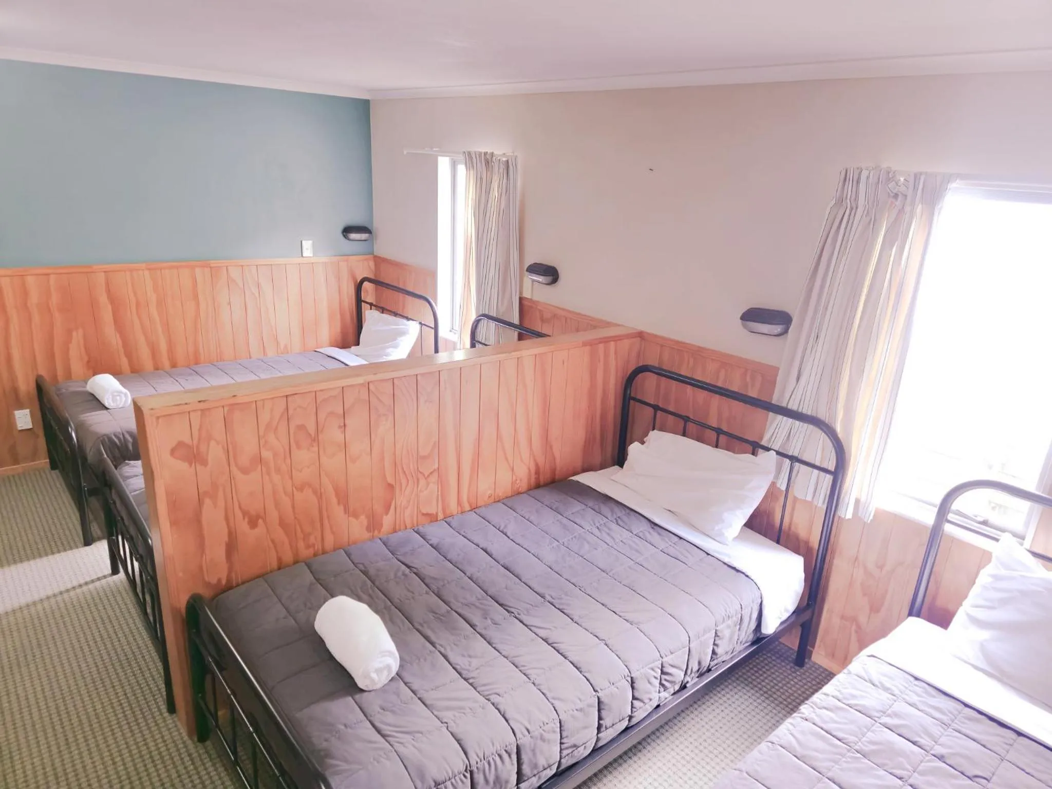 Bed in Waitomo Village Chalets home of Kiwipaka