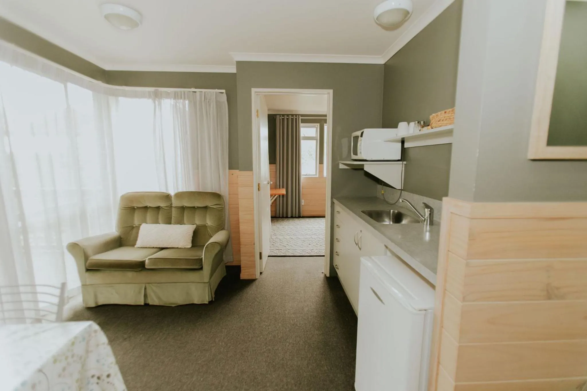 Kitchen or kitchenette in Waitomo Village Chalets home of Kiwipaka