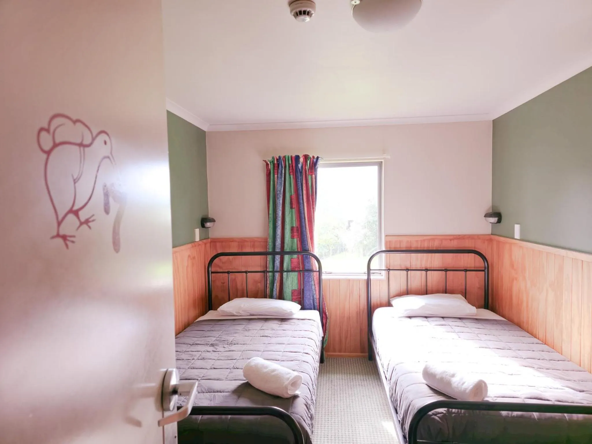 Bed in Waitomo Village Chalets home of Kiwipaka