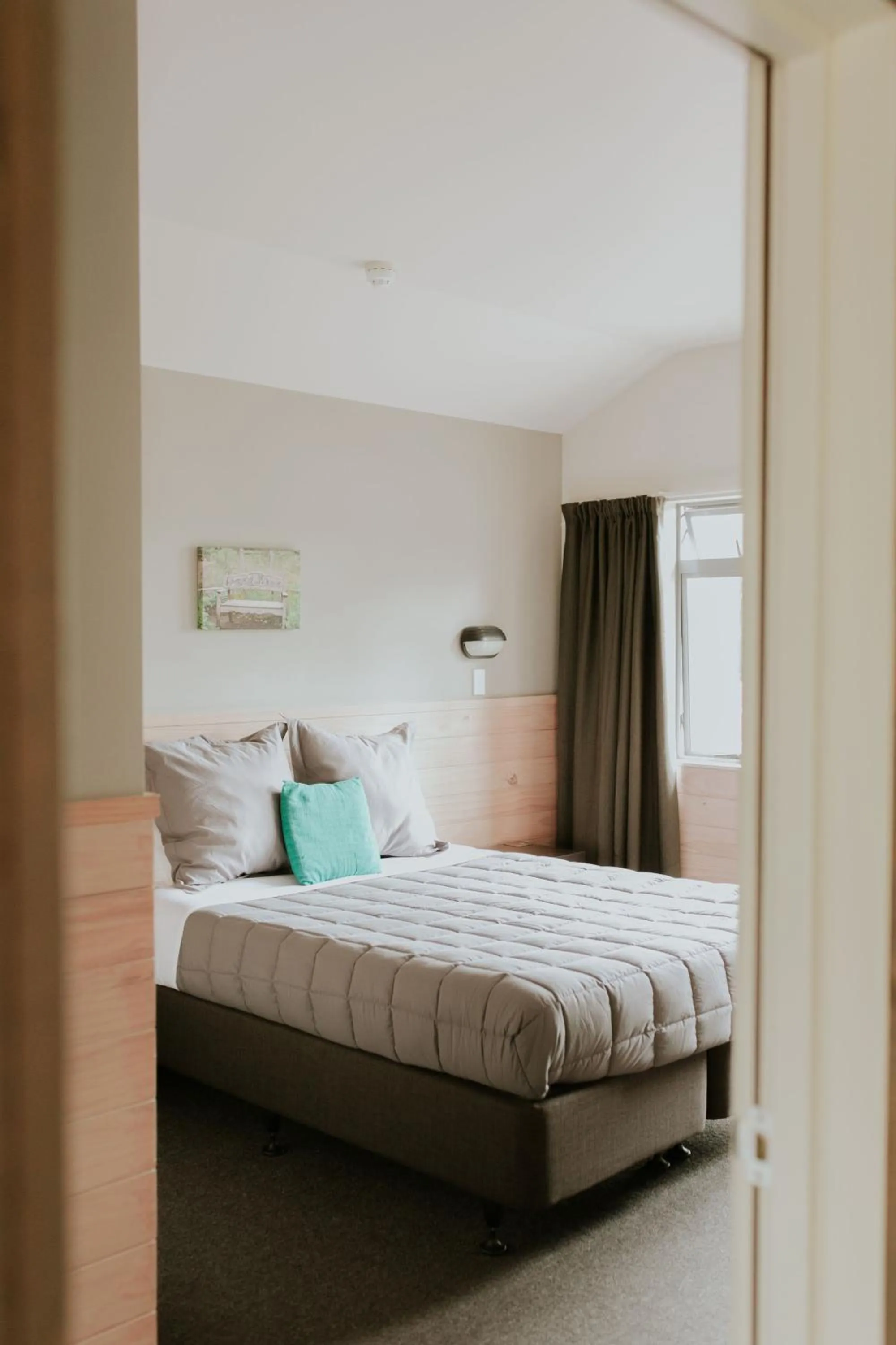 Bedroom, Bed in Waitomo Village Chalets home of Kiwipaka