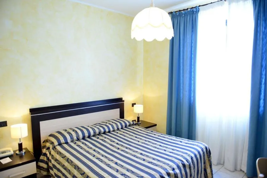 Bed in Hotel Blue Rose's