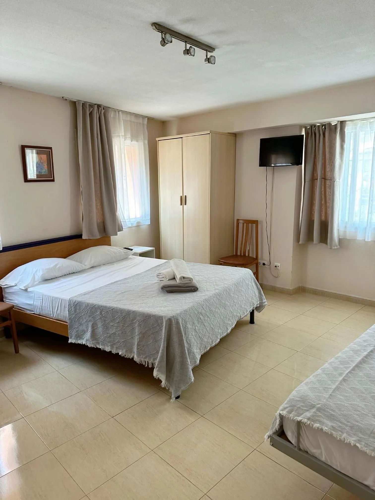 Bed in Royal Inn Aparthotel