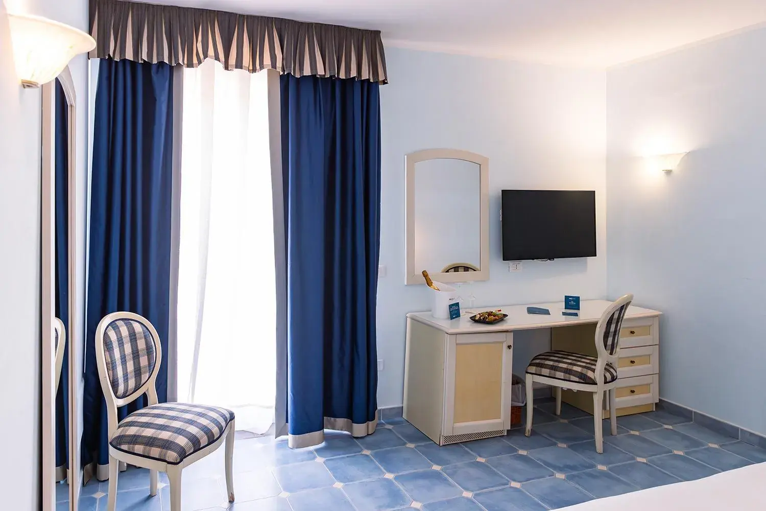 Bedroom in Baia dei Mulini Resort & Spa Bedroom in Baia dei Mulini Resort & Spa