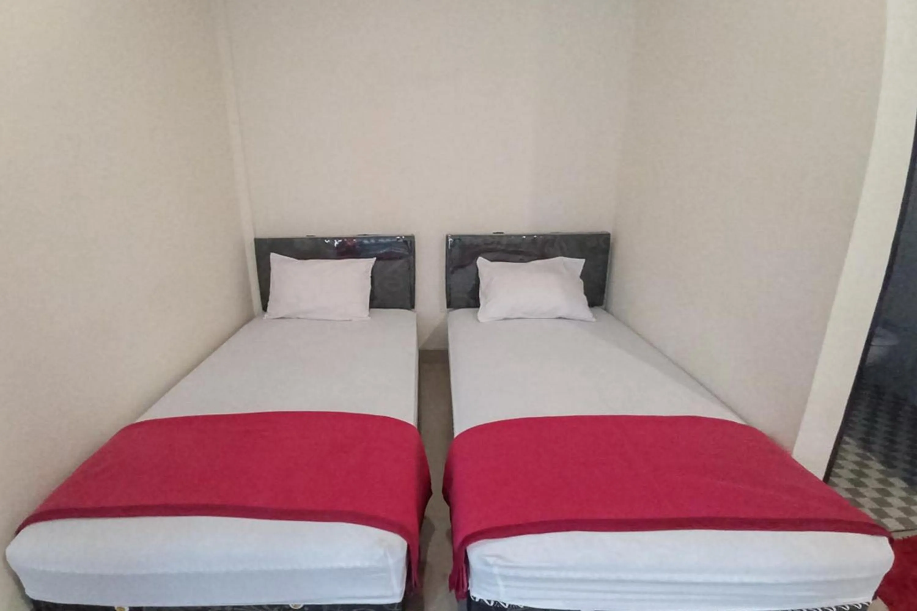 Bed in RedDoorz Syariah near Sentani City Square