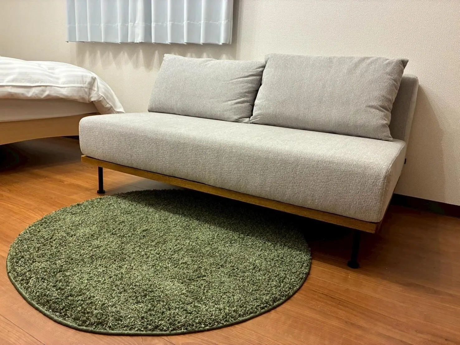 Seating area, Bed in Dash Living Shinjuku