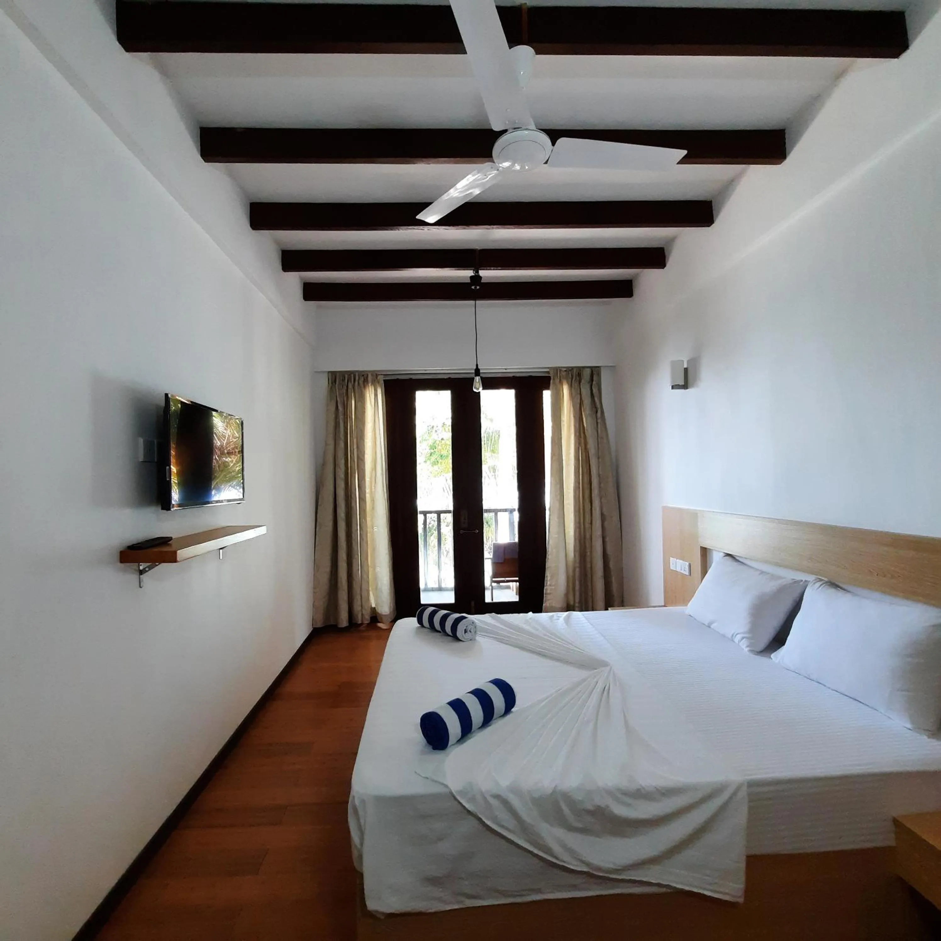 Photo of the whole room, Bed in Thundi Sea View