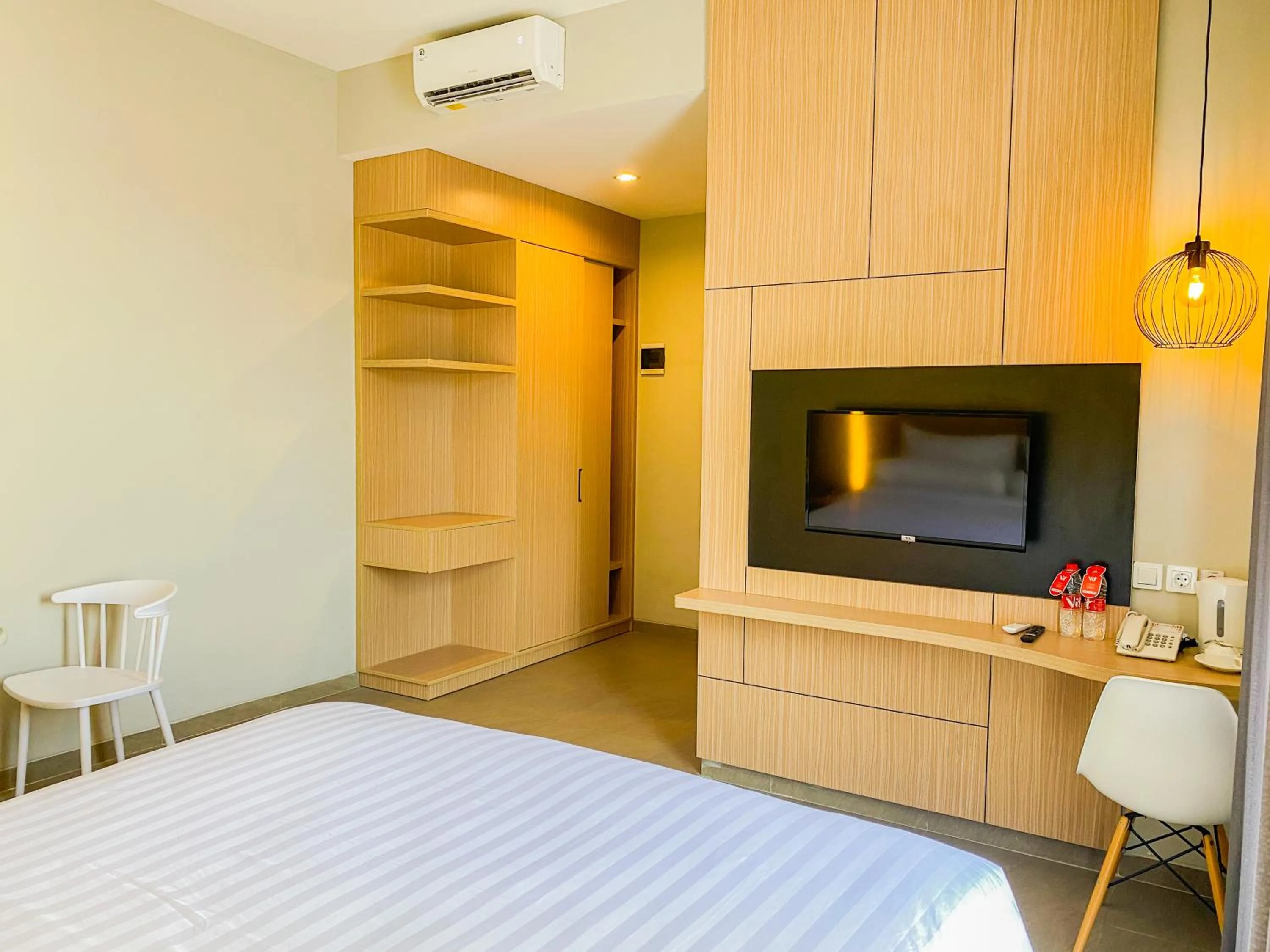 Property building, Bed in Front One King Hotel Tuban