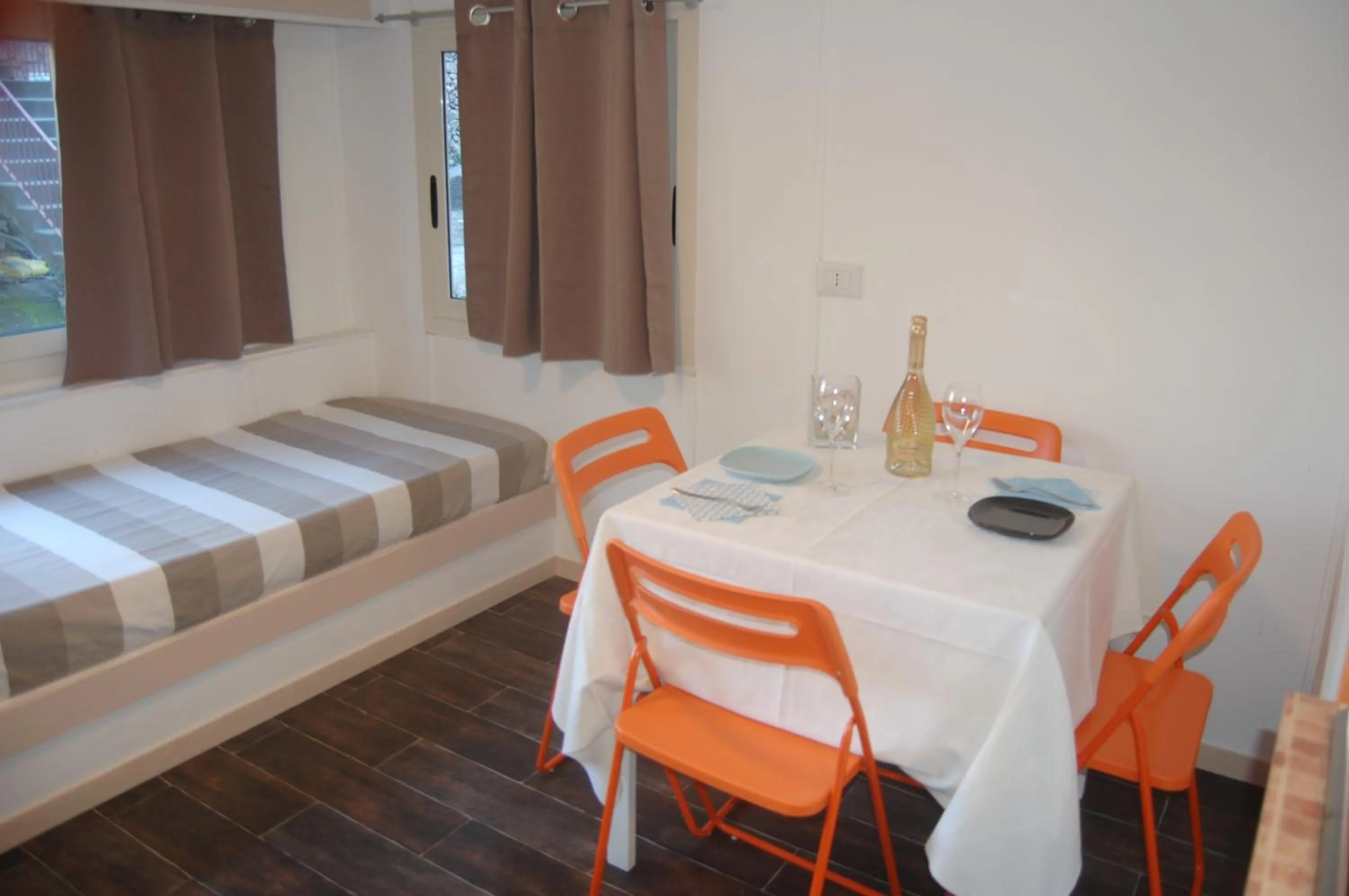 Living room, Bed in Villaggio Residence Nettuno