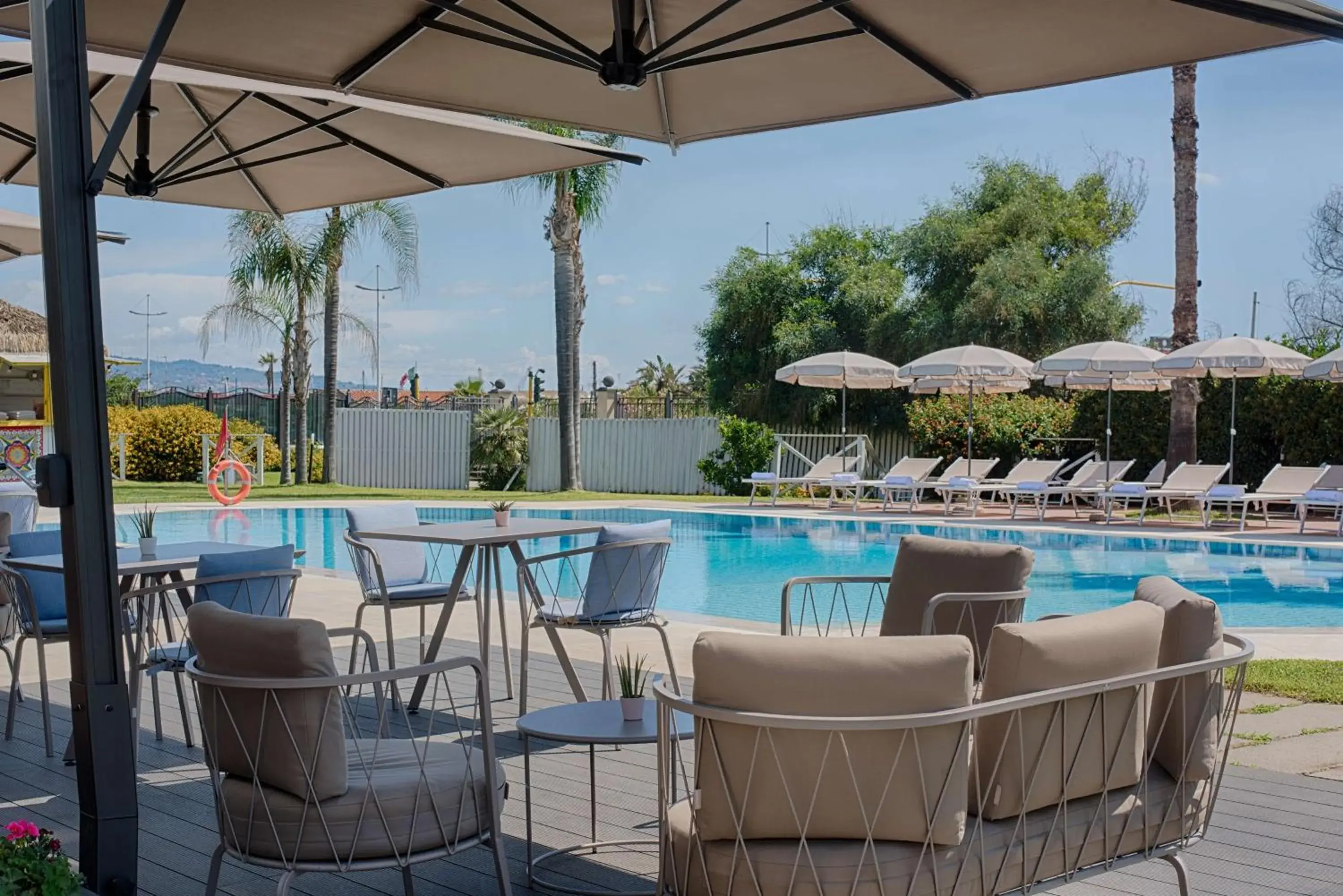 Pool view in NH Catania Parco degli Aragonesi Pool view in NH Catania Parco degli Aragonesi