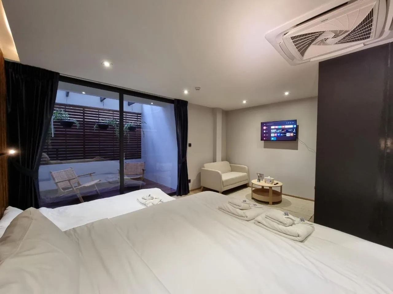 Photo of the whole room, Bed in The Nhorm Hotel Ratchada