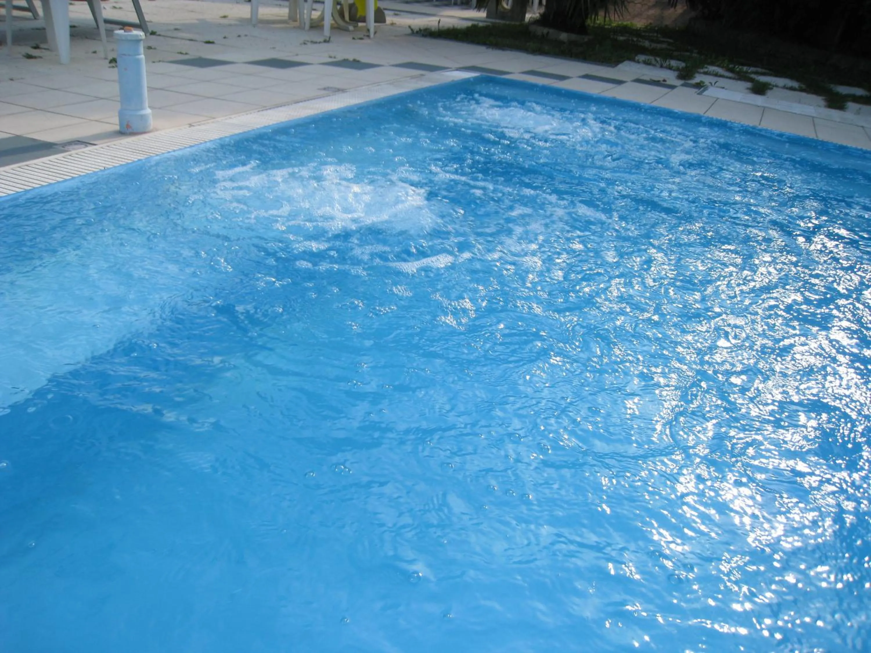 Swimming pool in Hotel Boomerang - Check-in & Meals in front at hotel Sporting