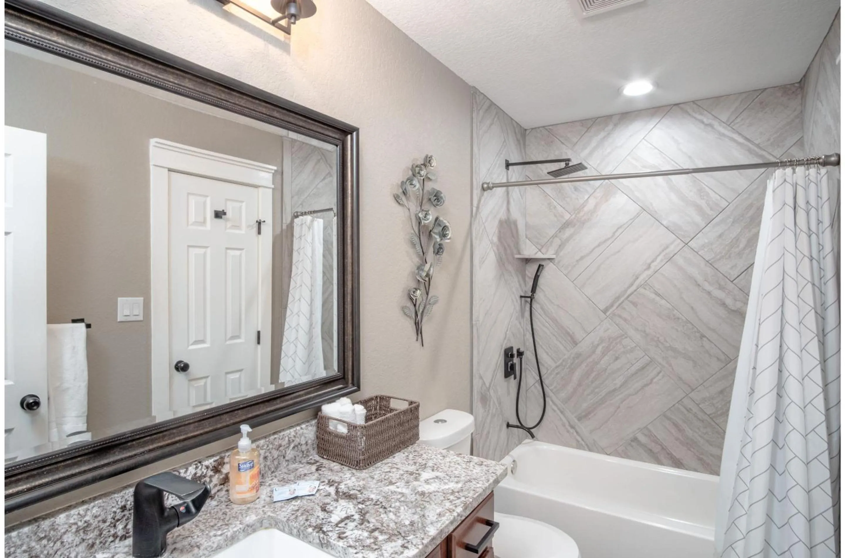 Bathroom in Lovely 3 BR Home Only 9 Minutes from Downtown