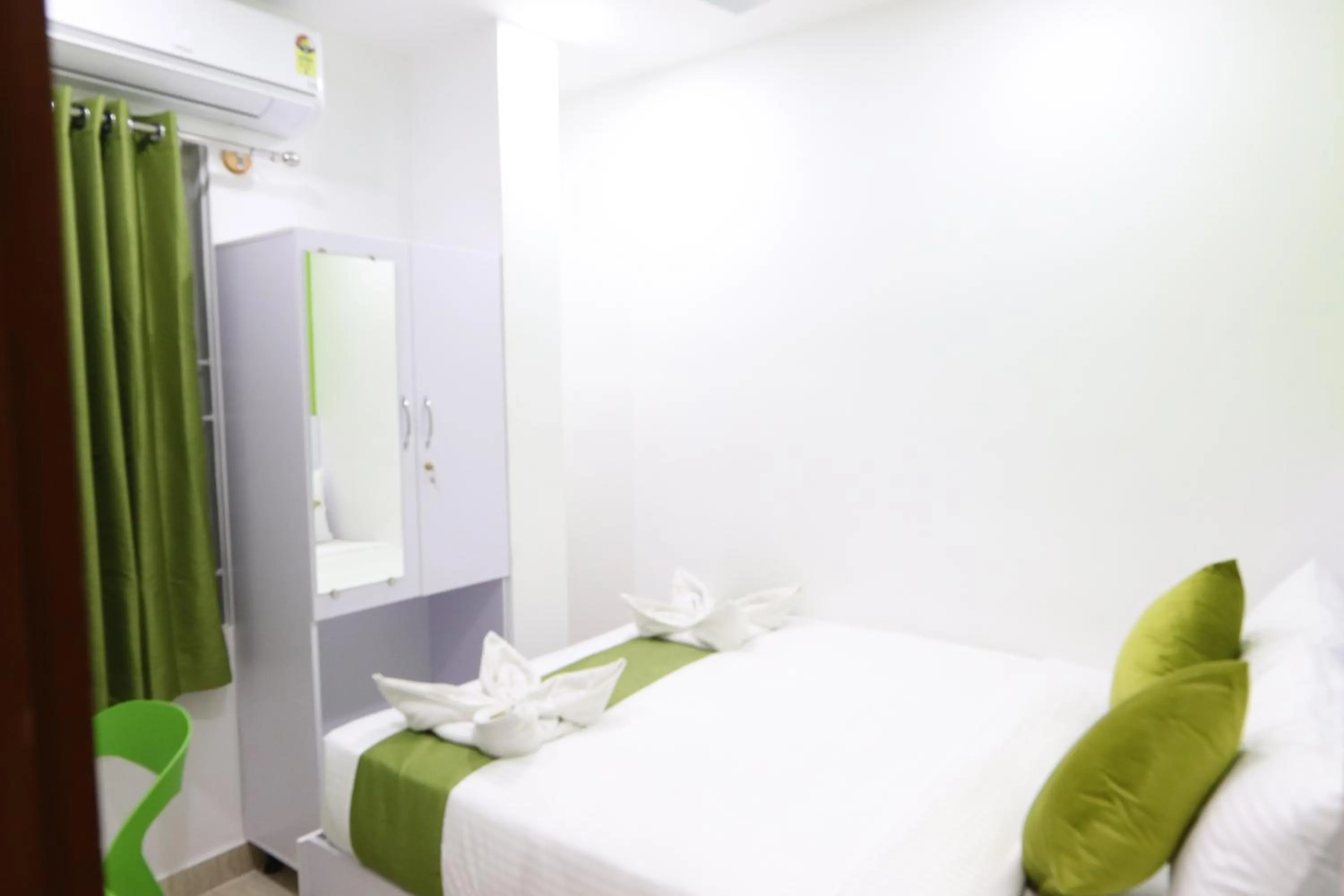 Bed in Athulya Stays