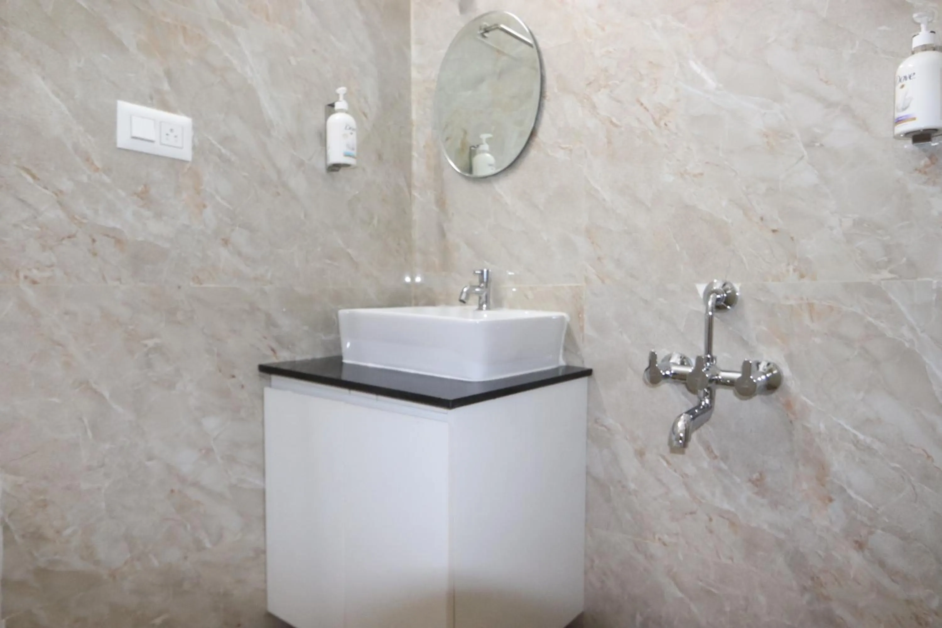 Bathroom in Athulya Stays