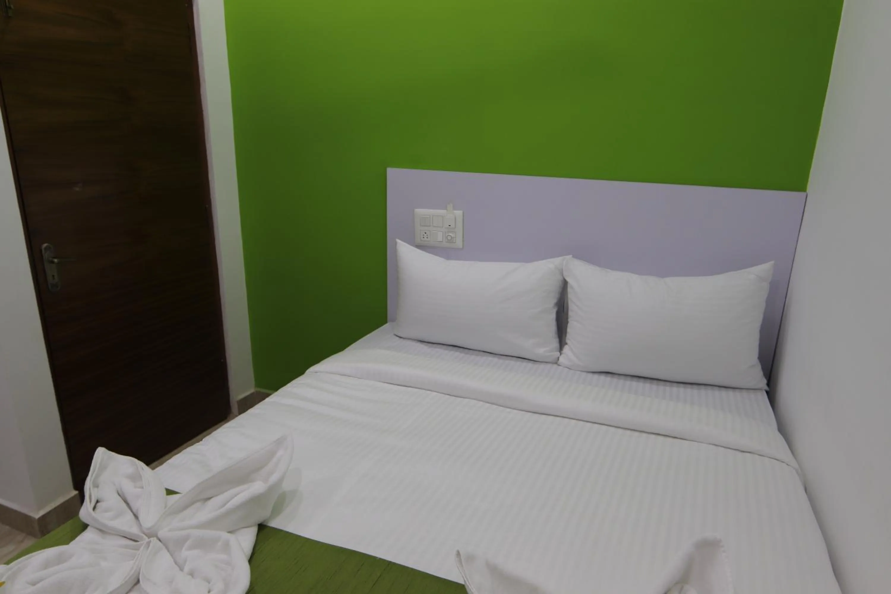 Bed in Athulya Stays