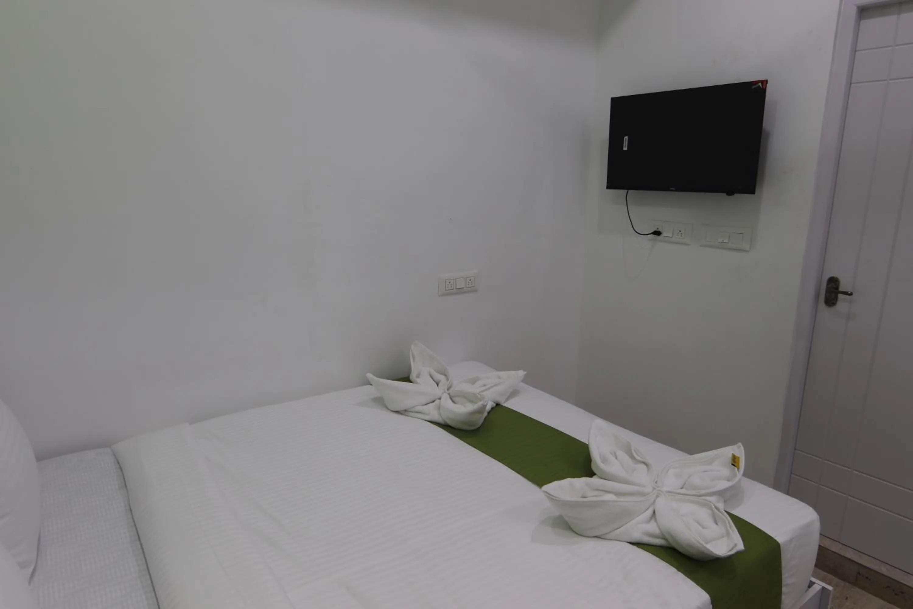 Bed in Athulya Stays