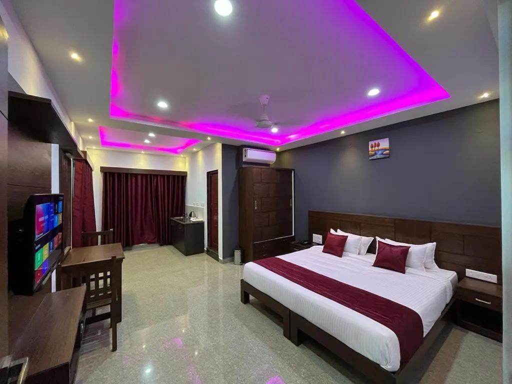 Communal lounge/ TV room, Bed in Coorg ASHOK PALACE