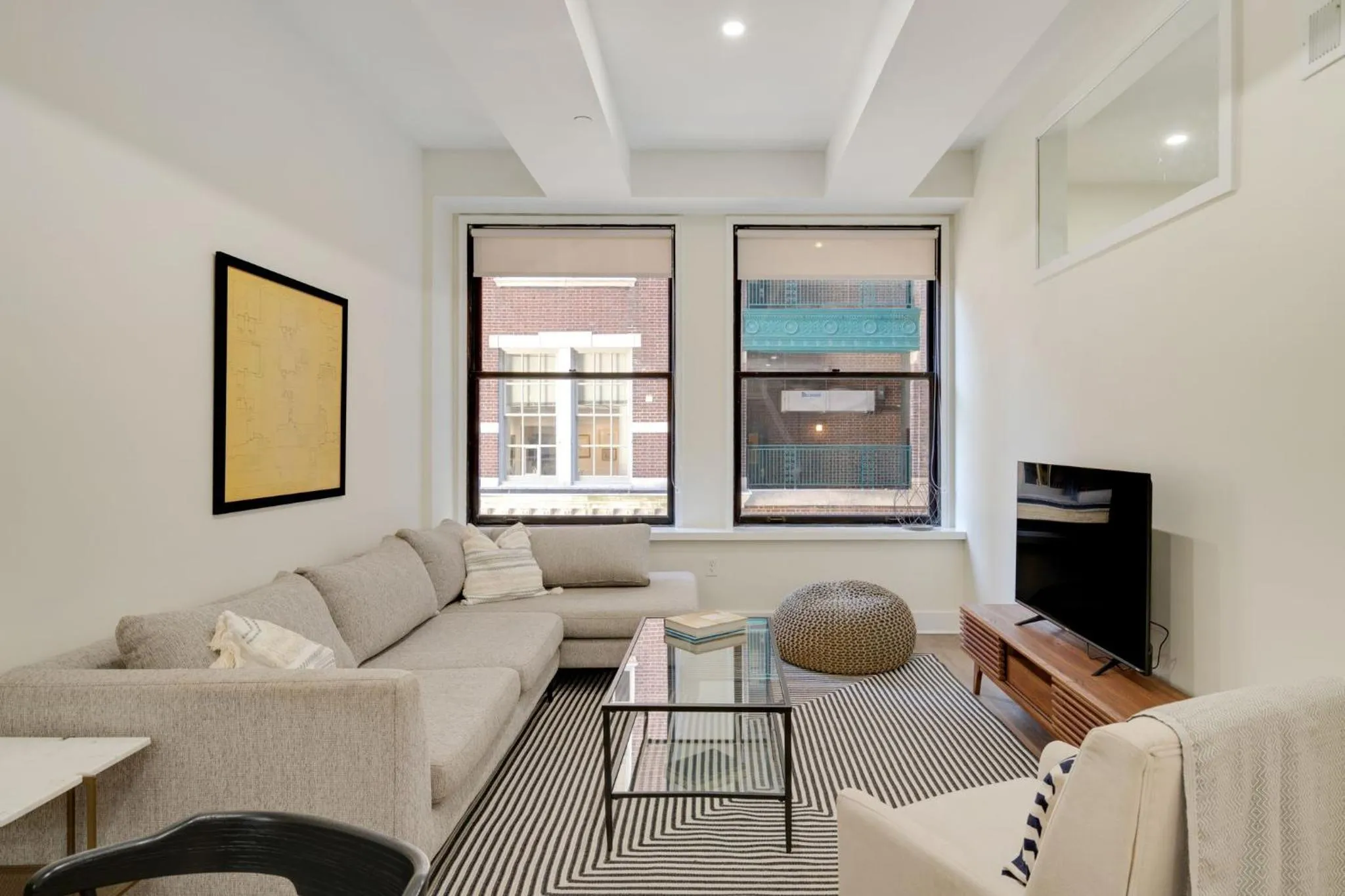 Living room in The Ledger Residences by Sosuite - Old City