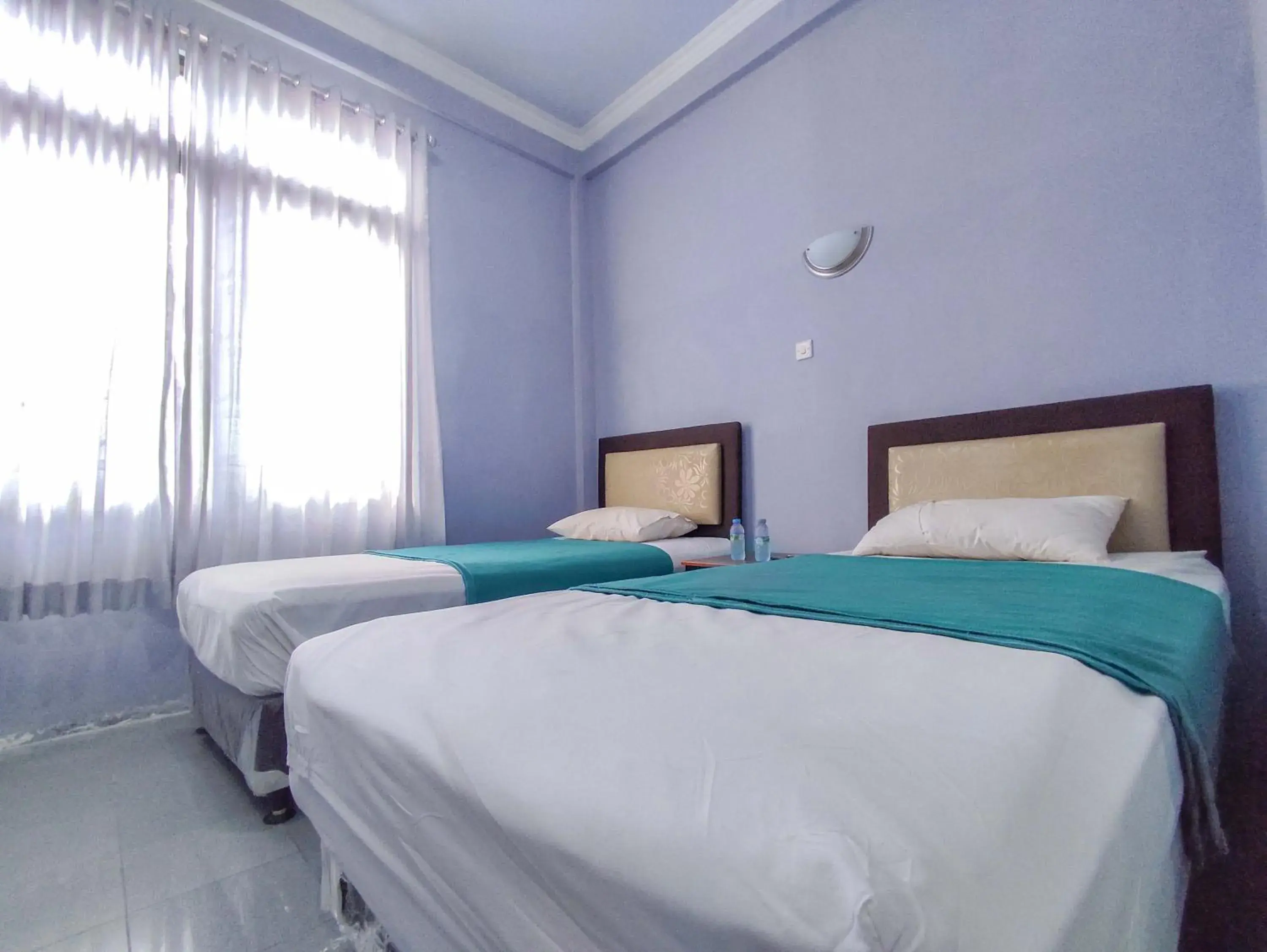 Bed in Wisma Tulus Syariah Kebumen Mitra RedDoorz Bed in Wisma Tulus Syariah Kebumen Mitra RedDoorz