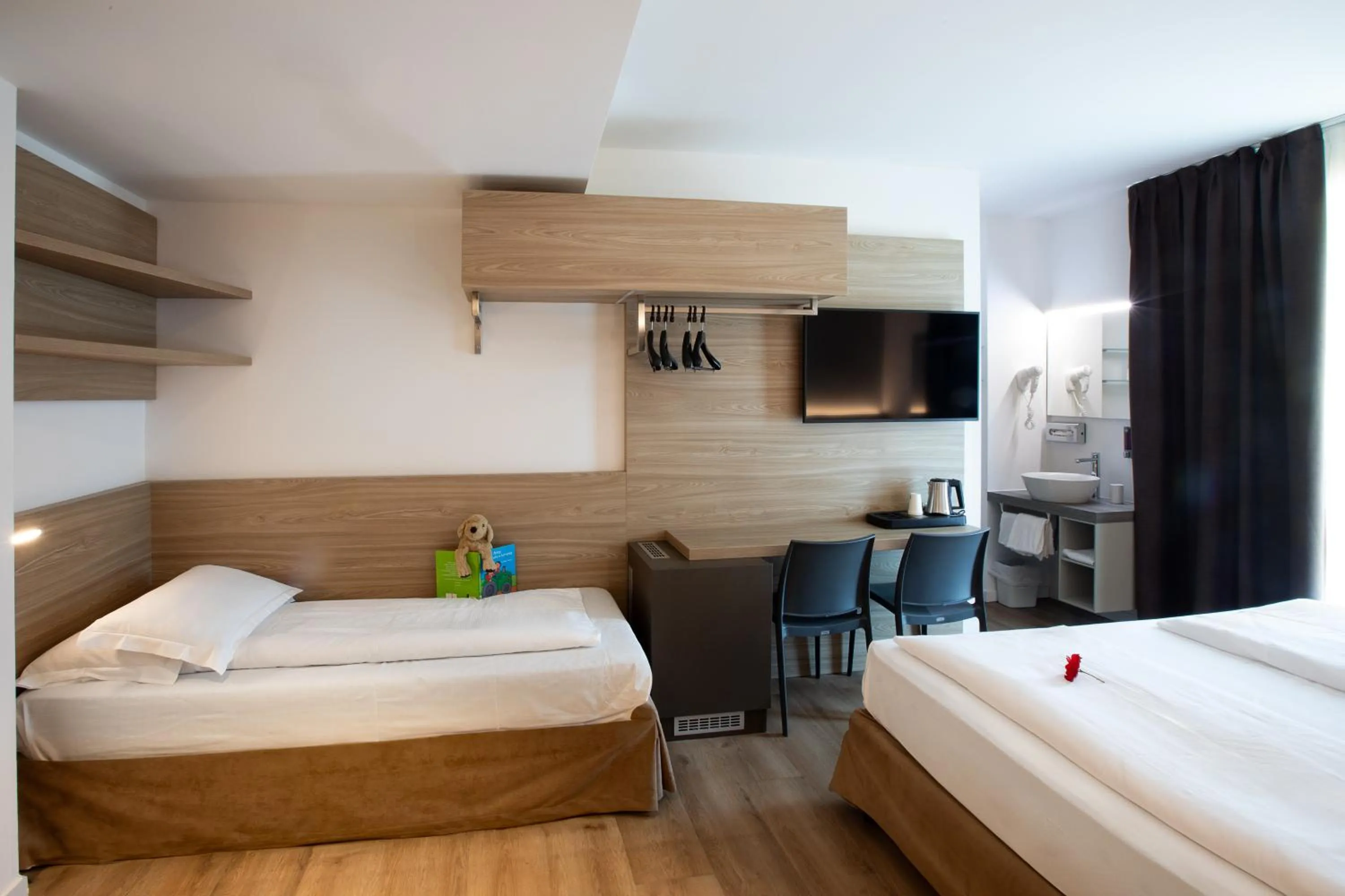 Bed in Ambassador Suite Hotel