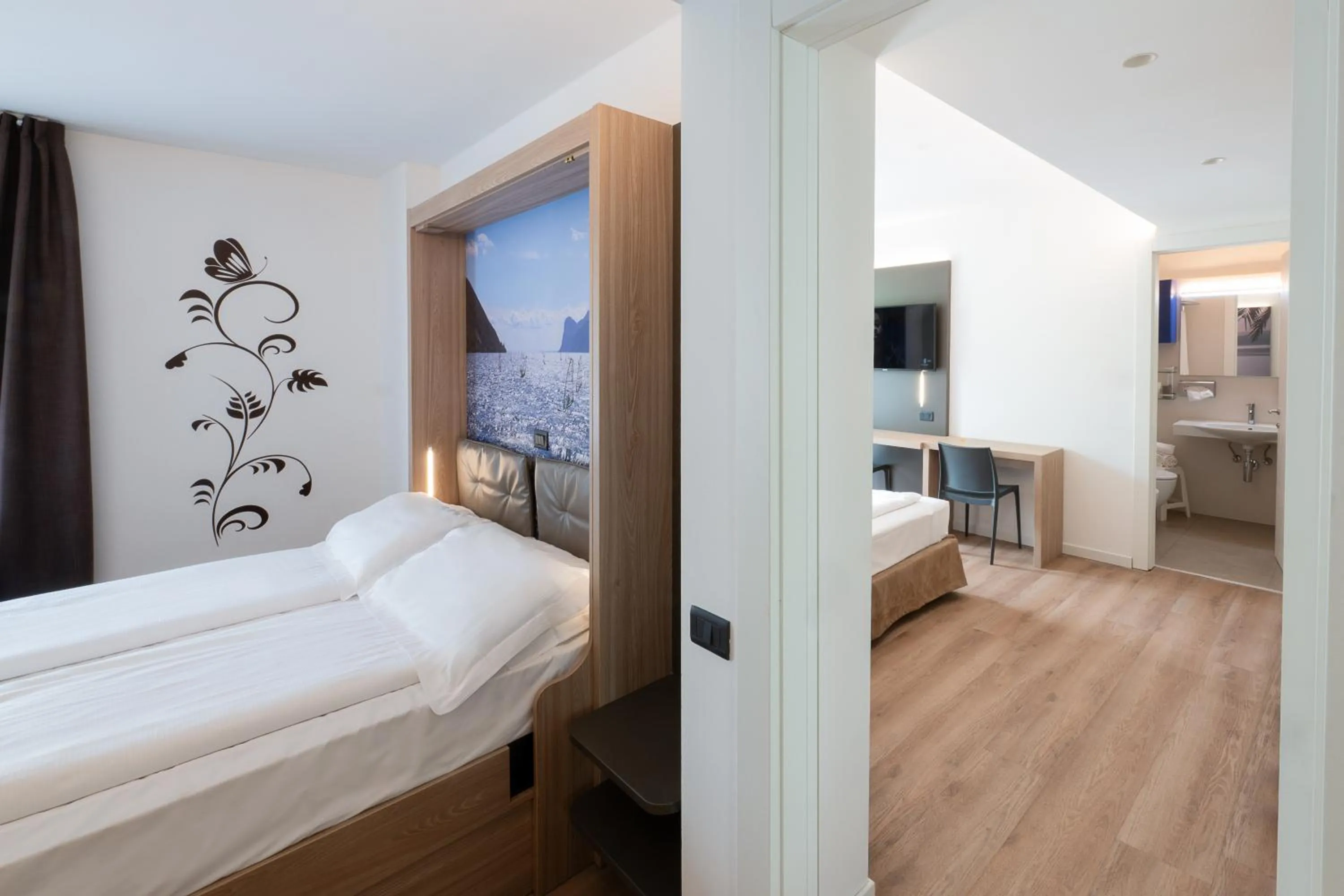 Bed in Ambassador Suite Hotel