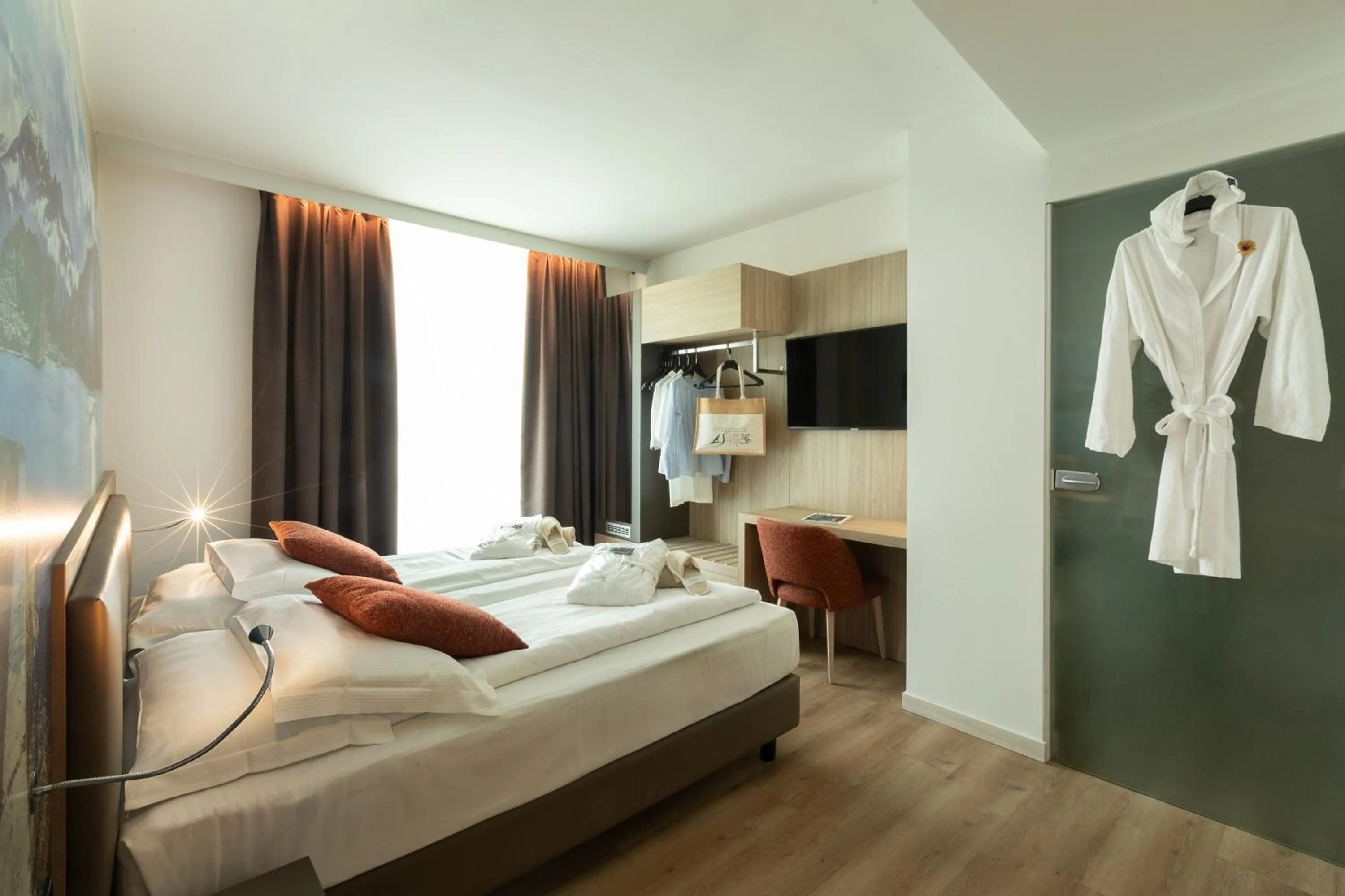 Bed in Ambassador Suite Hotel