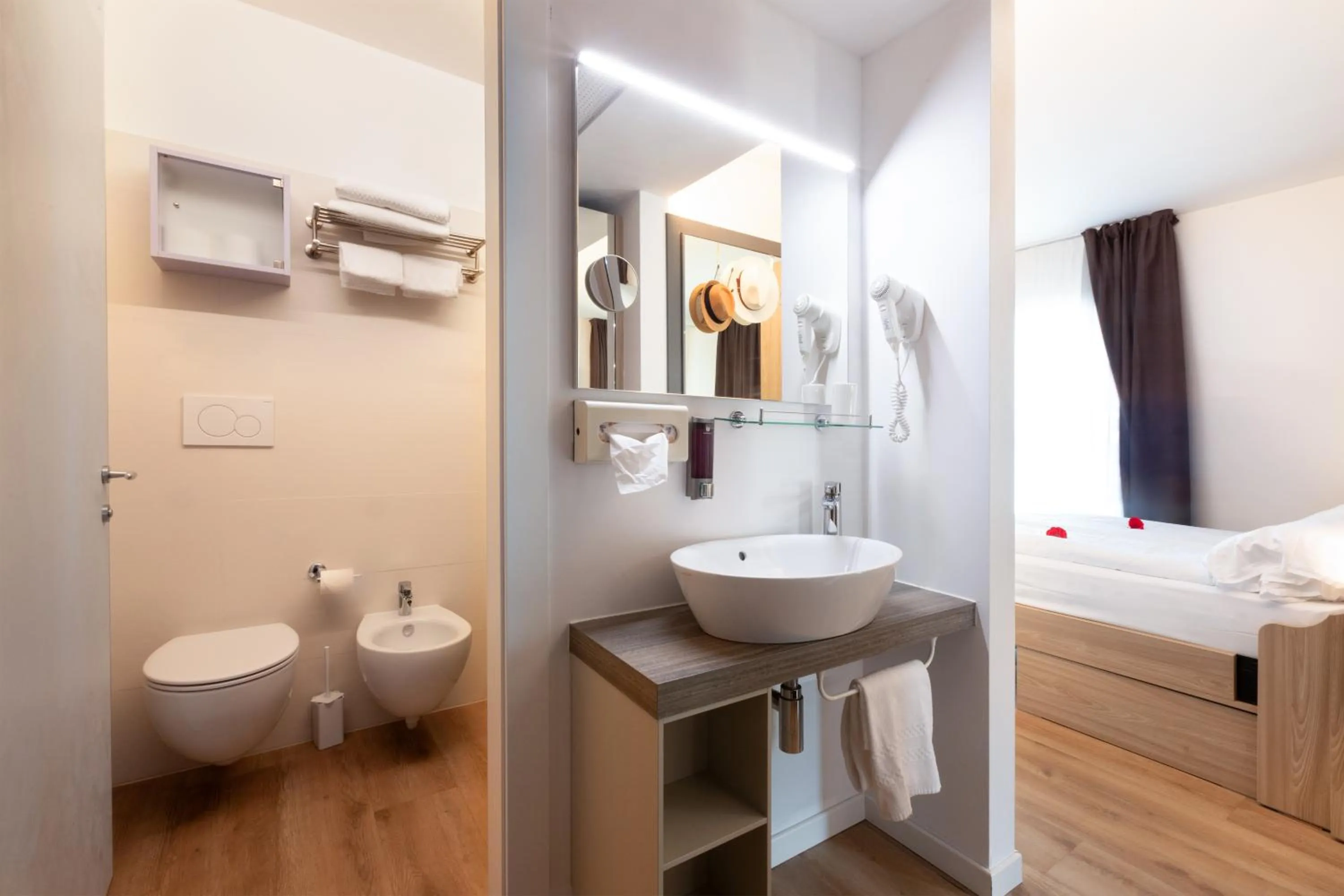 Bed in Ambassador Suite Hotel