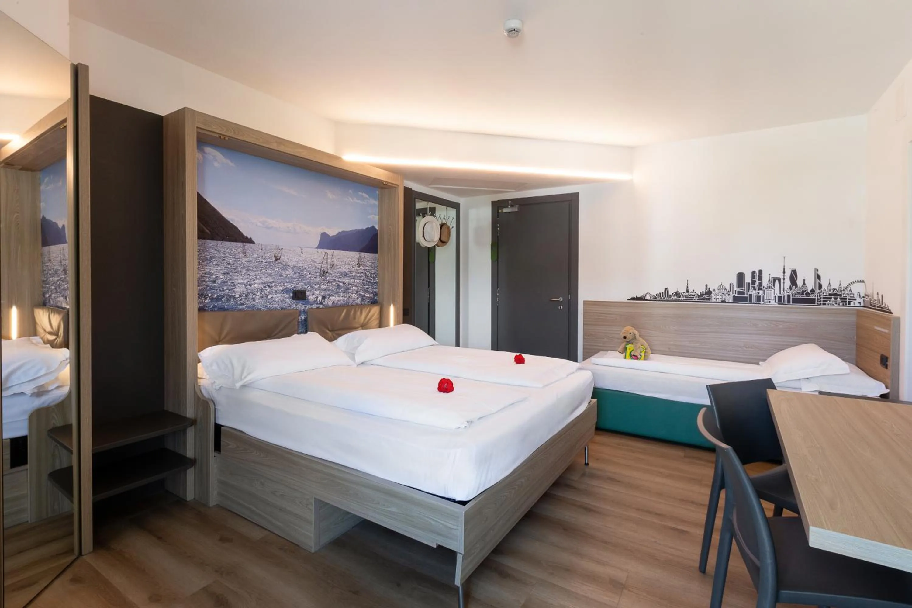 Bed in Ambassador Suite Hotel