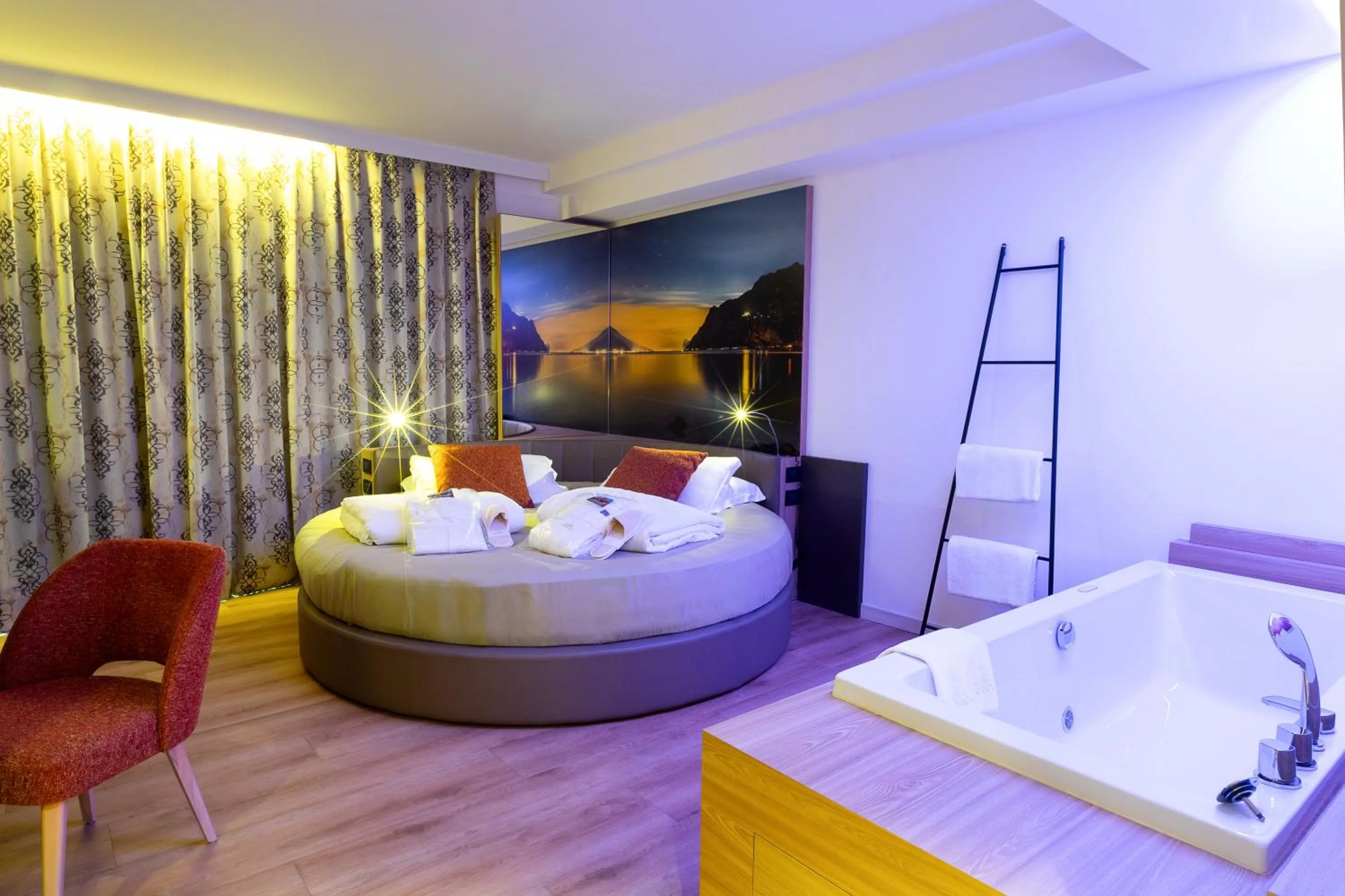 Bed in Ambassador Suite Hotel