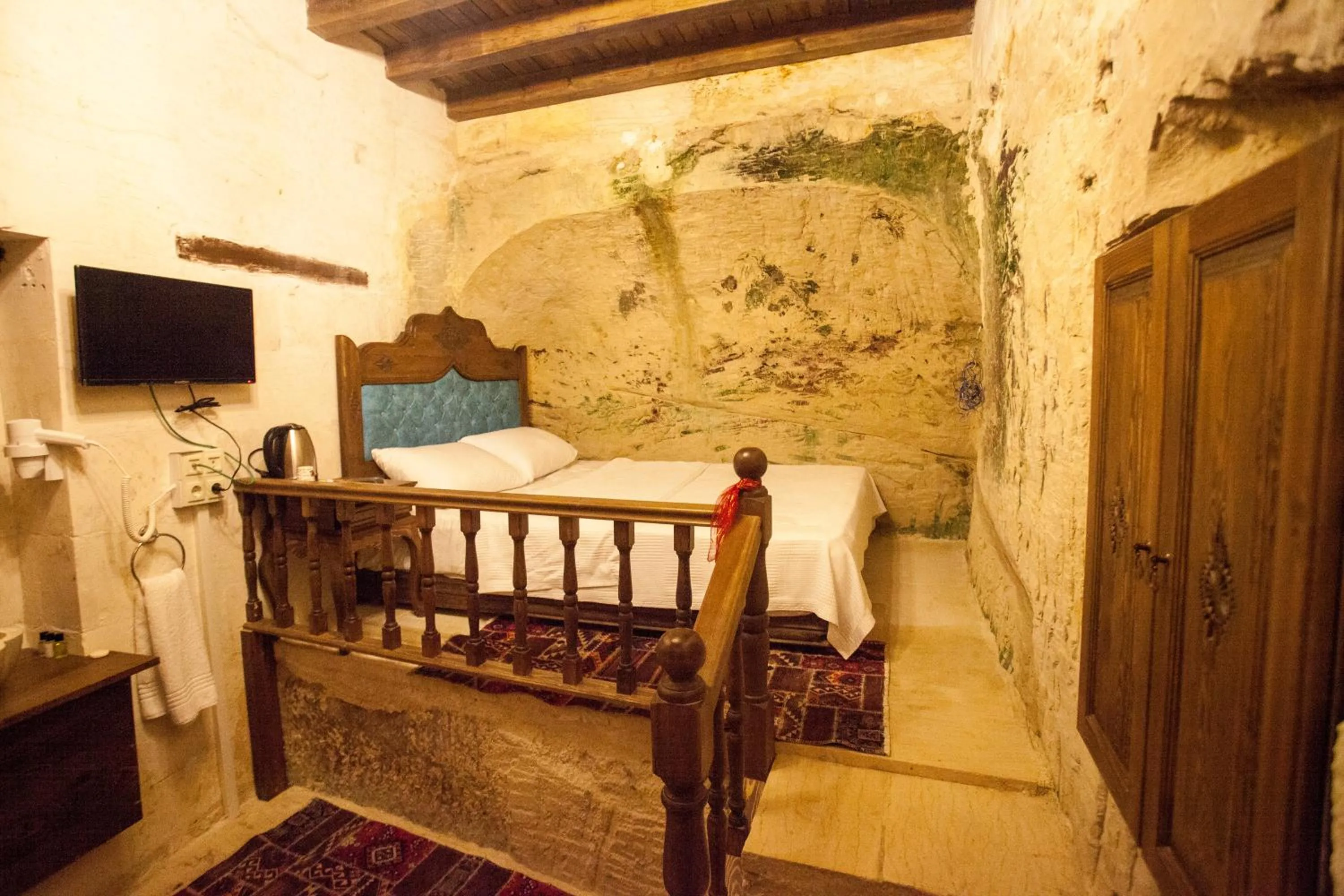 Bed in TÜRKMEN KONAGI HALFETİ BUTİK OTEL
