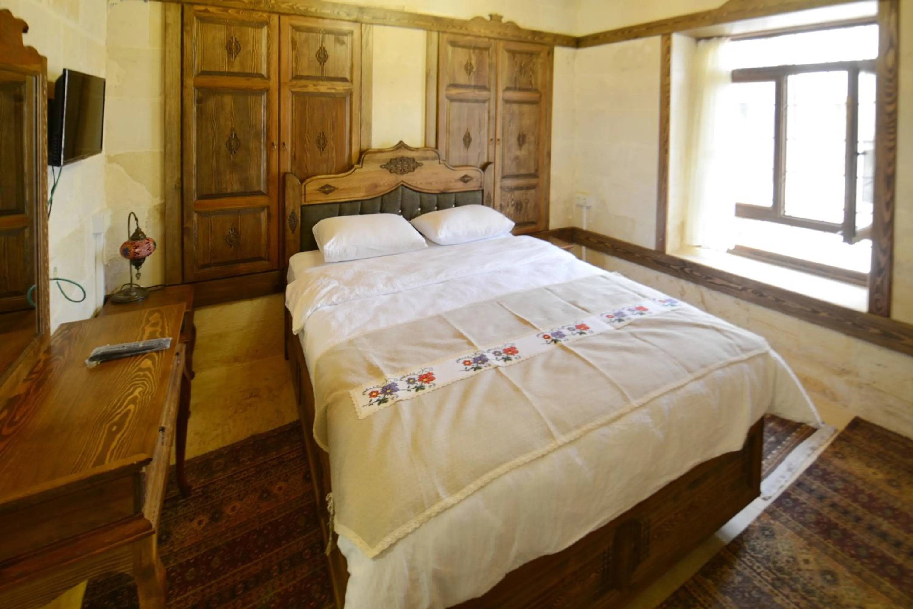 Bed in TÜRKMEN KONAGI HALFETİ BUTİK OTEL