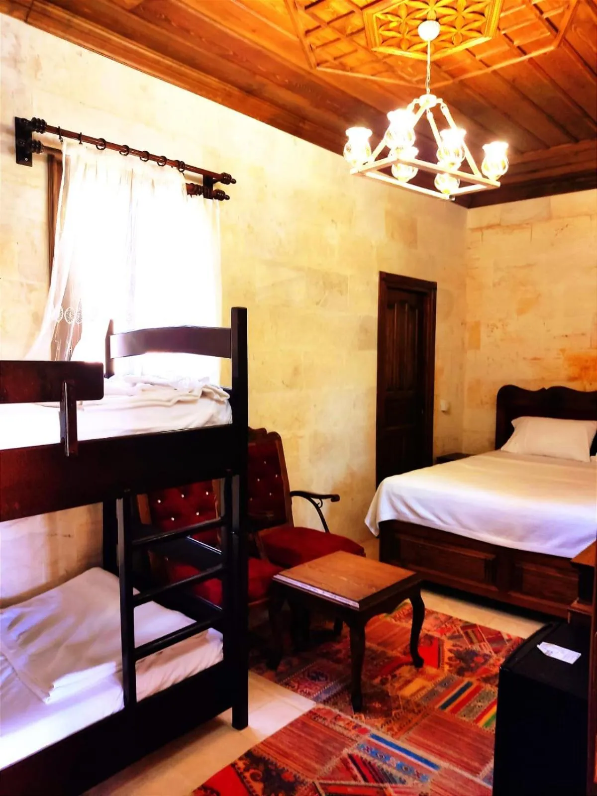 Bed in TÜRKMEN KONAGI HALFETİ BUTİK OTEL